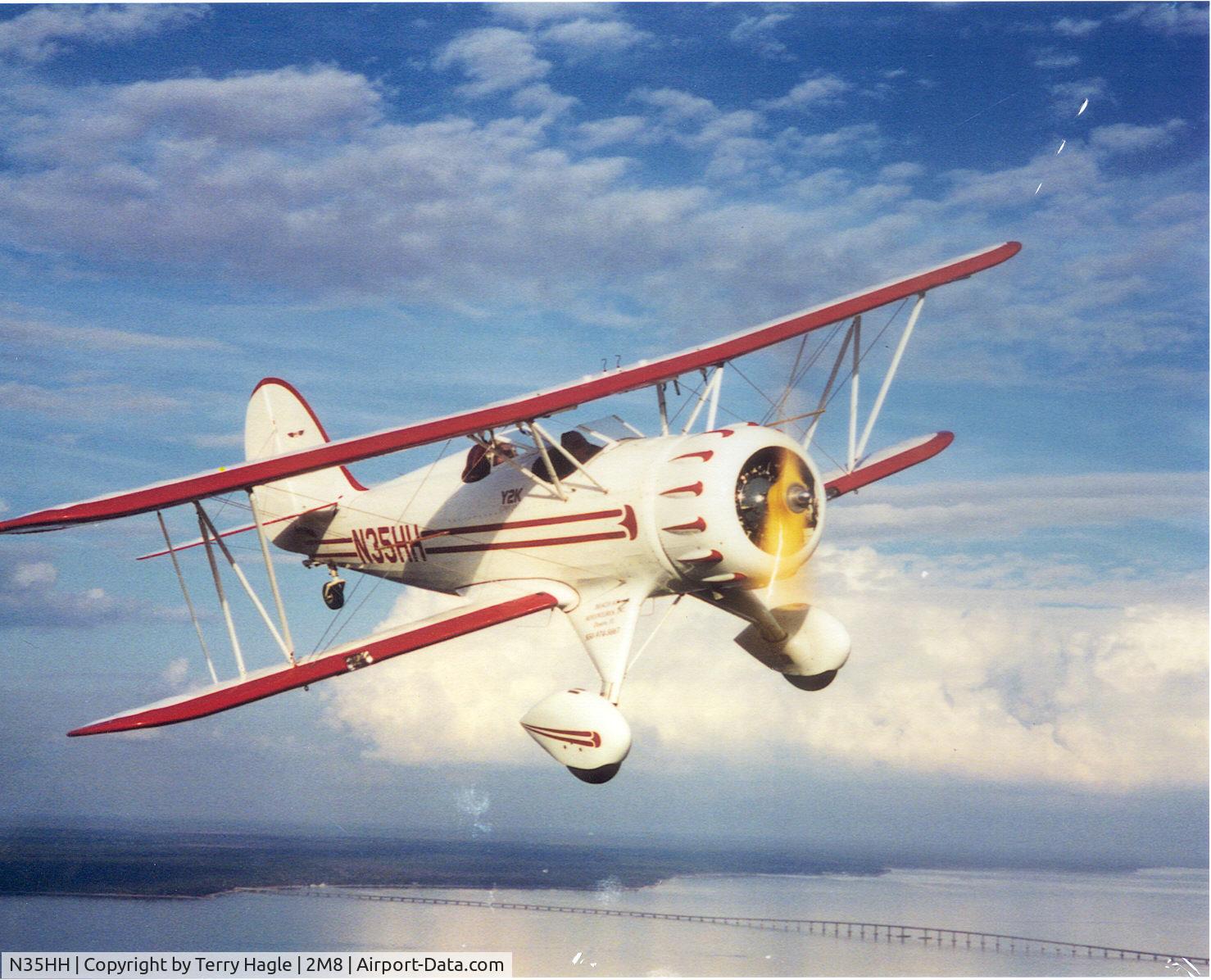 N35HH, 1988 Classic Aircraft Corp WACO YMF C/N F5-017, In flight over the Florida coast