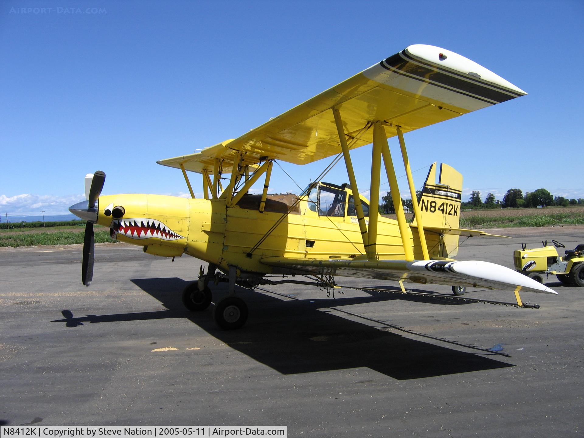 N8412K, 1982 Grumman-Schweizer G-164B C/N 690B, Sutter Butte Dusters Turbo Ag-Cat rigged for spraying and sporting sharkmouth at airstrip NE of Live Oak, CA