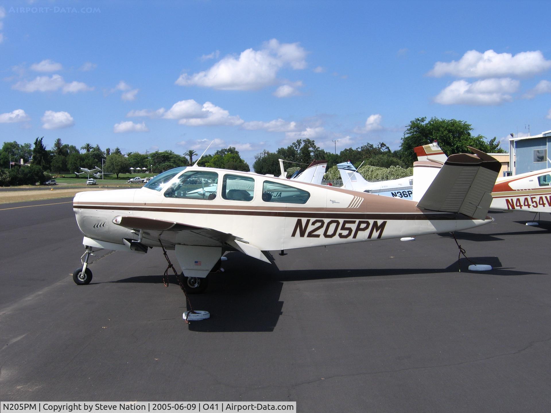 N205PM, 1964 Beech S35 Bonanza C/N D-7599, King Aviation's 1964 Beech S35 (minus prop) at Woodland Aviation