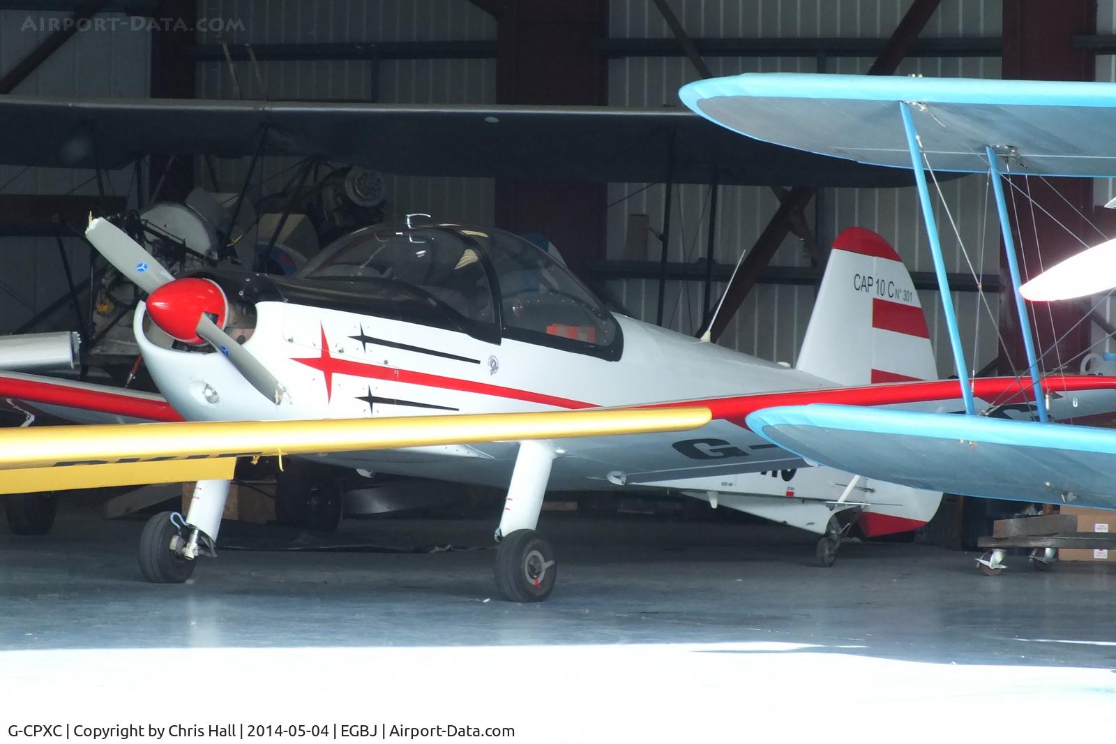 G-CPXC, 2002 Mudry CAP-10B C/N 301, in the Tiger Airways hangar at Staverton