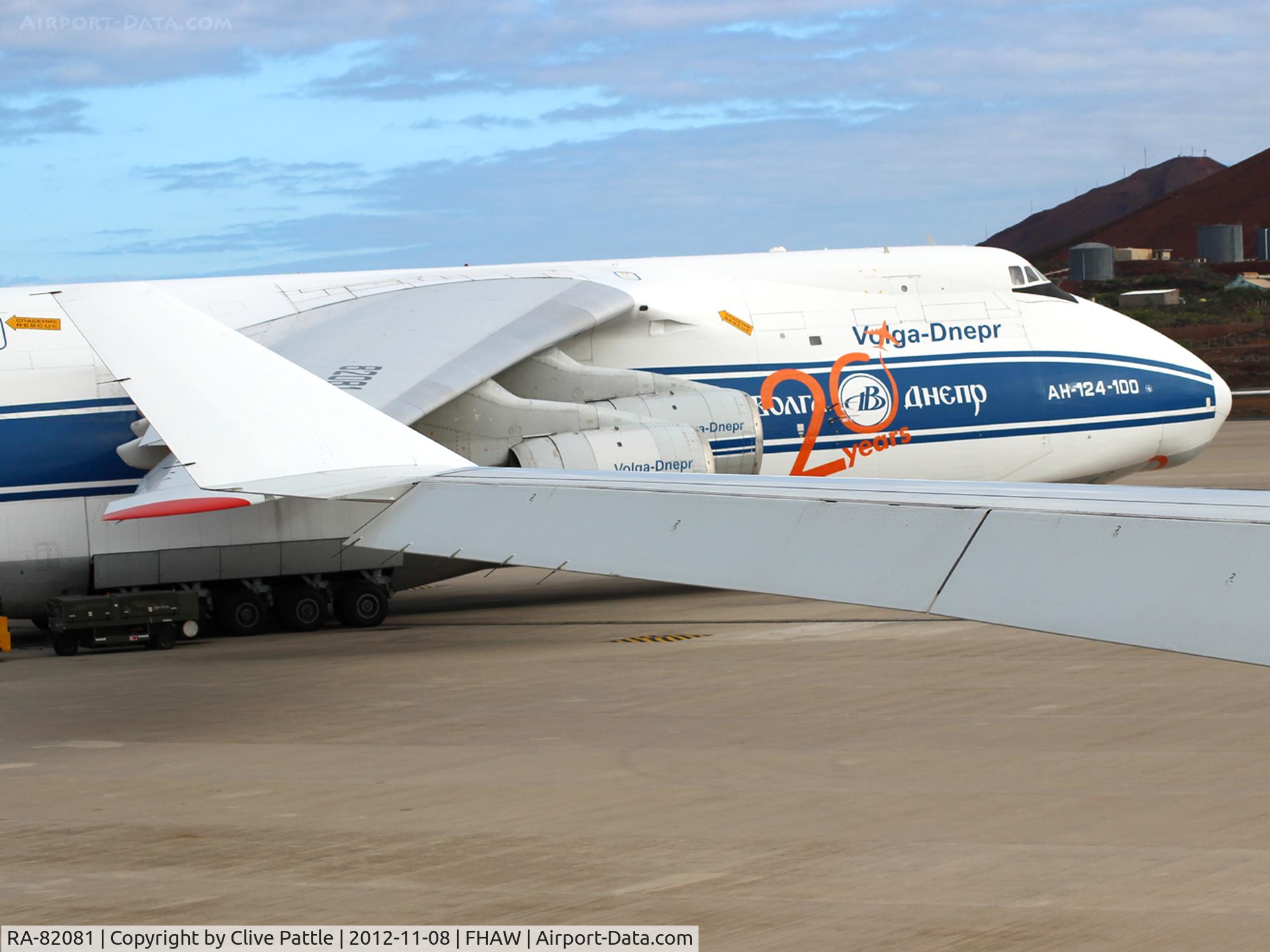 RA-82081, 2004 Antonov An-124-100M Ruslan C/N 9773051462165, Pictured on ramp at Ascension Island. Picture taken from a taxying aircraft. Note Special Anniversary Marks on Antonov nose.