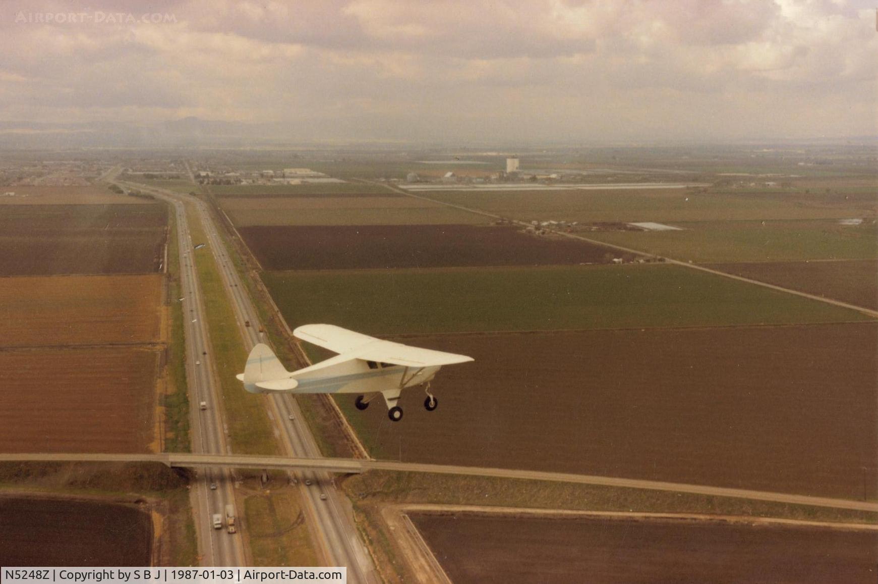 N5248Z, 1961 Piper PA-22-108 Colt C/N 22-8931, 48Z over I80 near Sacramento. Flight was to deliver her to its new owner. This was in late 1986.