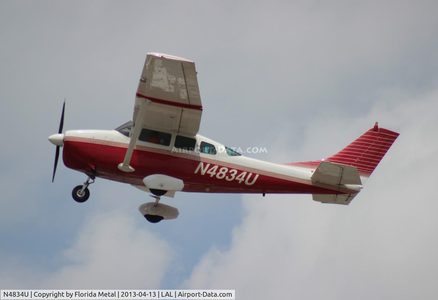 N4834U, 1963 Cessna 210-5A(205A) C/N 205-0534, Cessna 205A Super Skylane leaving Sun N Fun