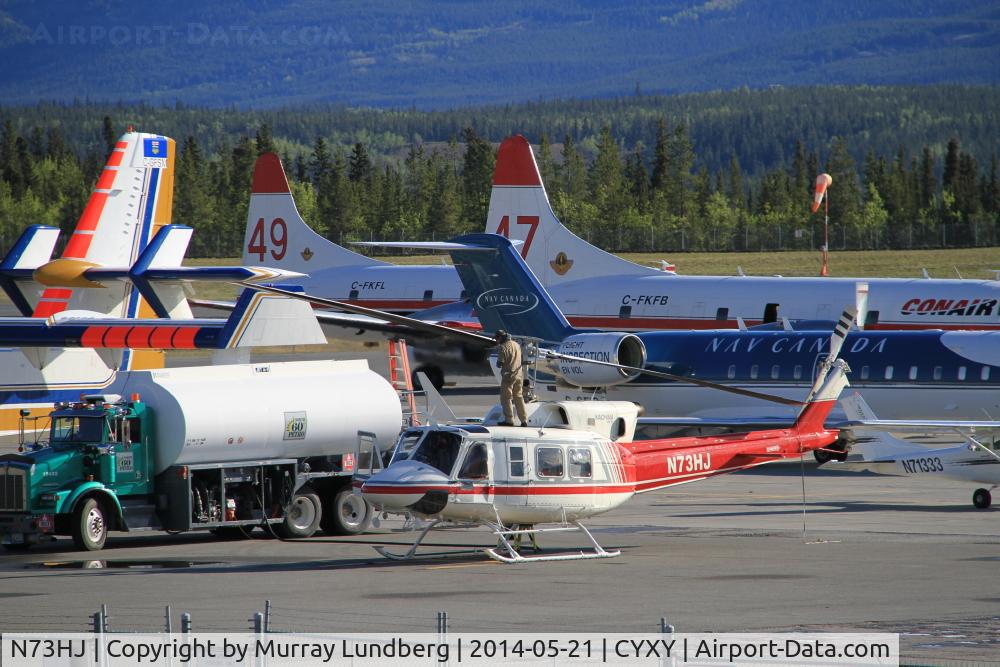 N73HJ, 1972 Bell 212 C/N 30552, Fueling up on the very busy ramp at Whitehorse, Yukon, with water bombers headed to Alaska to help fight the Funny River fire.