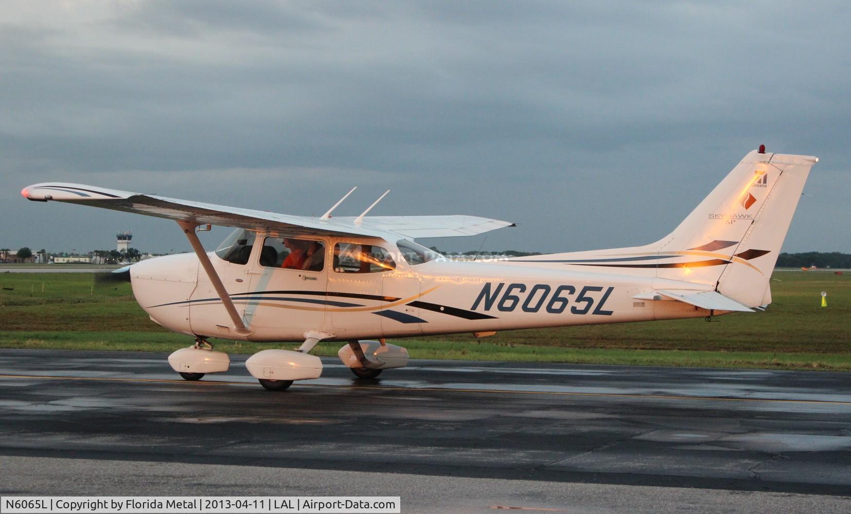 N6065L, 2006 Cessna 172S C/N 172S10250, Cessna 172S leaving Sun N Fun
