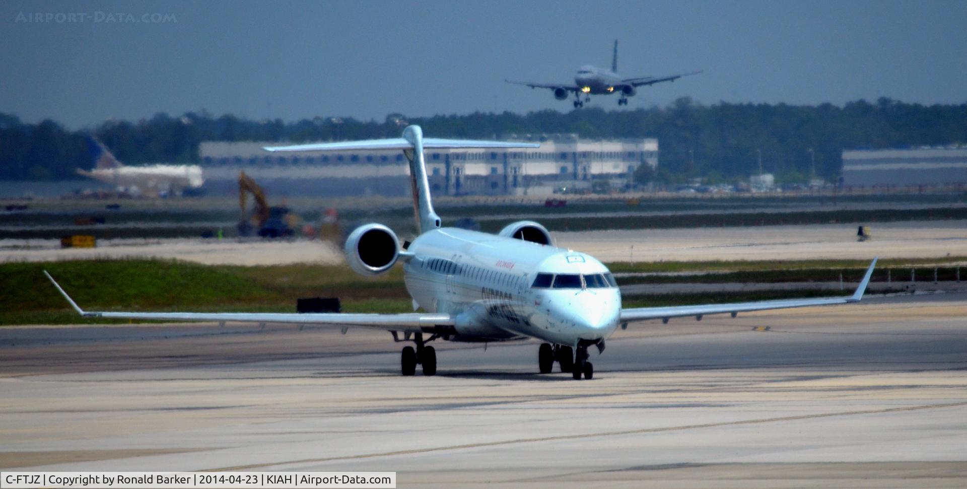 C-FTJZ, 2005 Canadair CRJ-705ER (CL-600-2D15) Regional Jet C/N 15047, Taxi to park Houston