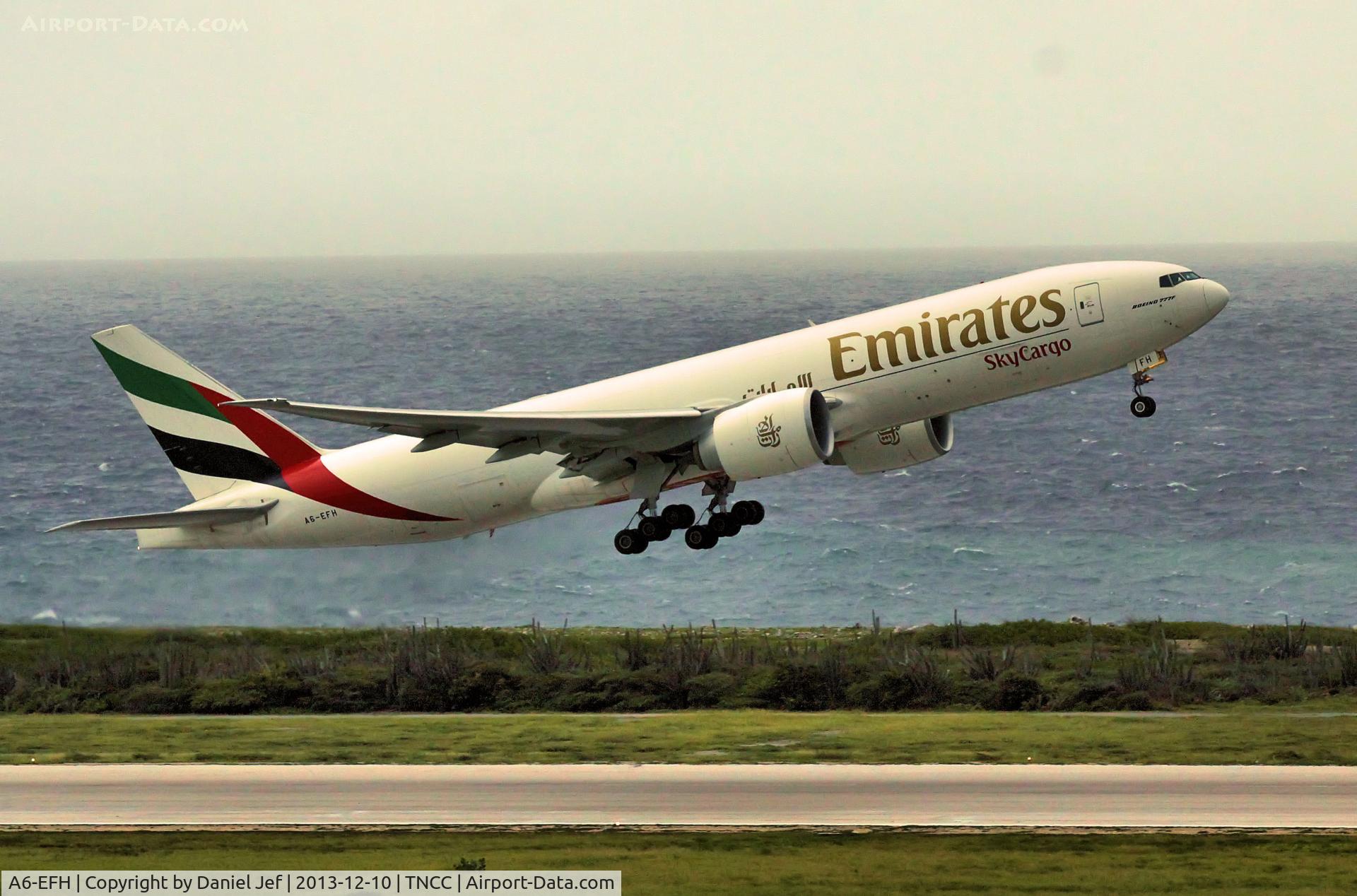 A6-EFH, 2012 Boeing 777-F1H C/N 35608, A6-EFH departing TNCC