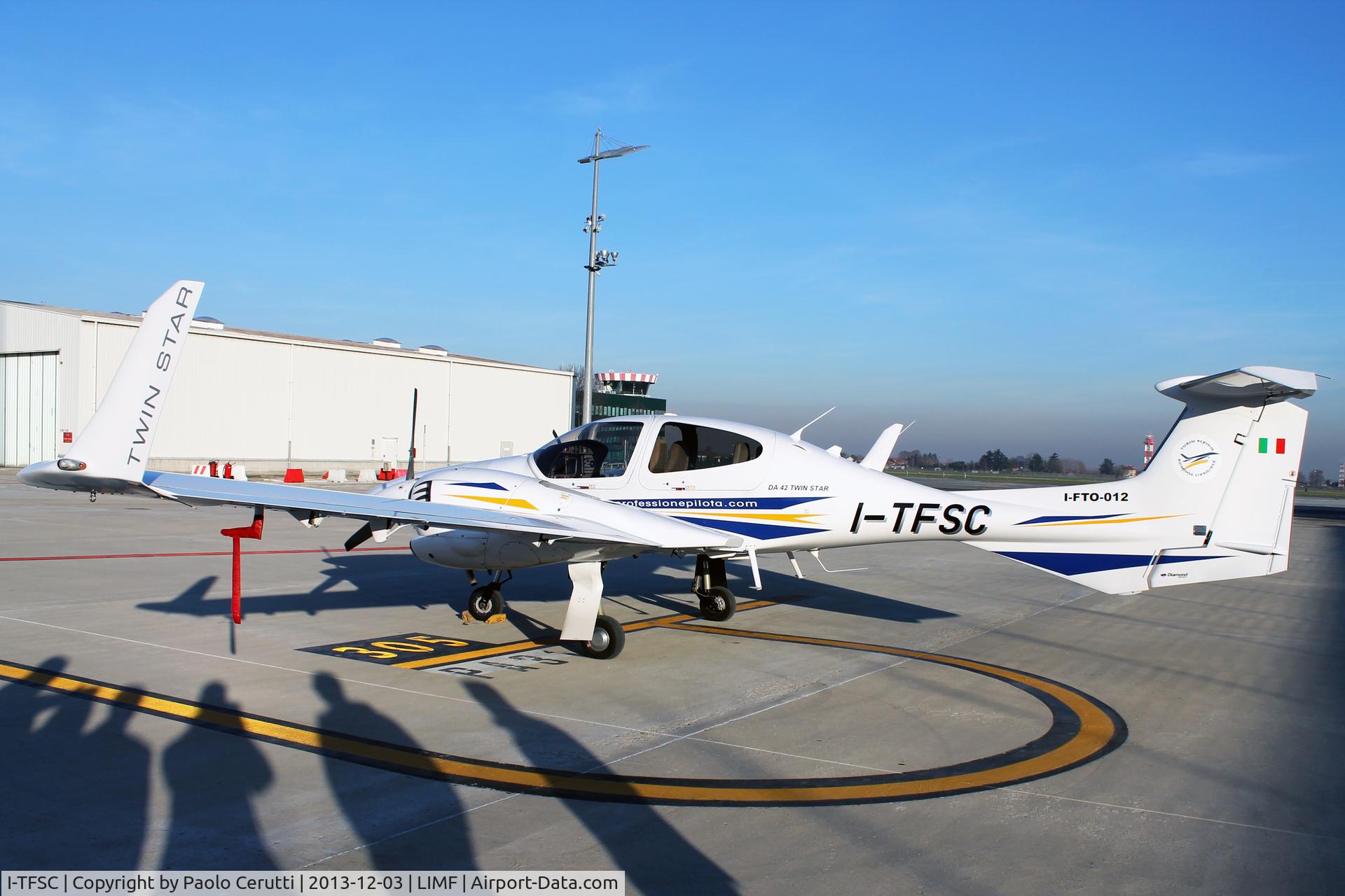 I-TFSC, 2007 Diamond DA-42 Twin Star C/N 42.303, Parked with Torino Tower in the background.