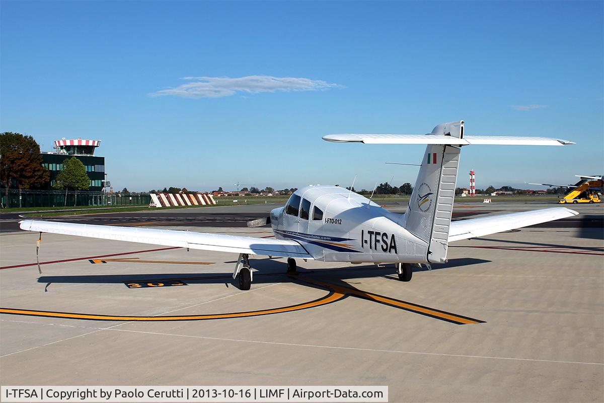 I-TFSA, 1979 Piper PA-28RT-201 Arrow IV Arrow IV C/N 28R-7918114, Parked with Torino's ATC Tower in the background