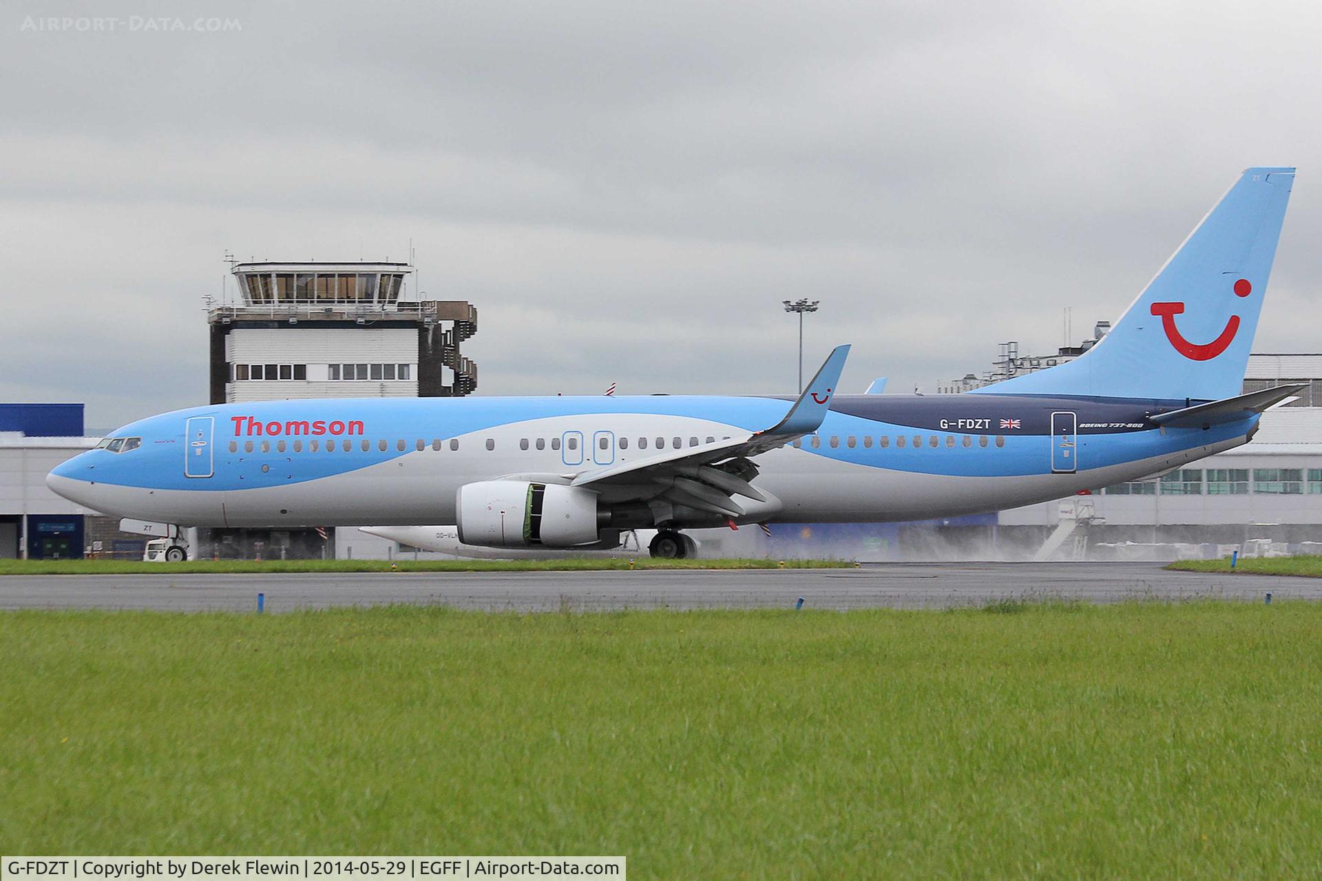 G-FDZT, 2011 Boeing 737-8K5 C/N 37248, Callsign, Thomson 46H, landing on runway 30 at EGFF, out of faro, showing open reverse thruster doors.