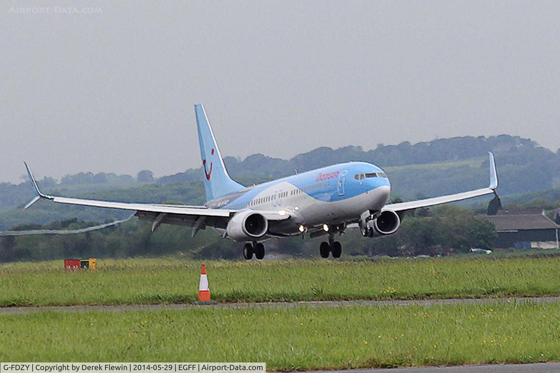 G-FDZY, 2011 Boeing 737-8K5 C/N 37261, Callsign, Thomson 4HE, landing on runway 12 at EGFF, out of Malaga.