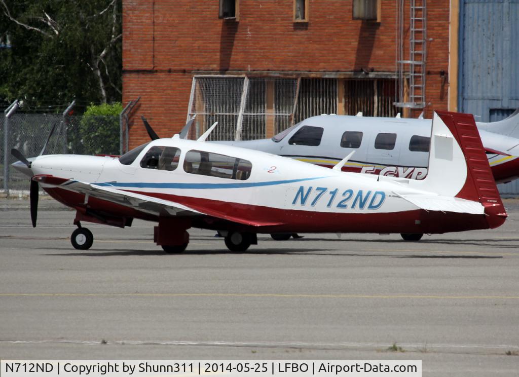 N712ND, 2005 Mooney M20R Ovation C/N 29-0413, Parked at the General Aviation area...