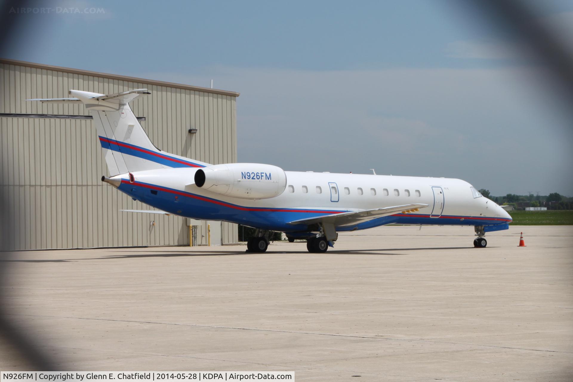 N926FM, 2001 Embraer ERJ-135ER (EMB-135ER) C/N 145466, Photographed through the chain-link fence