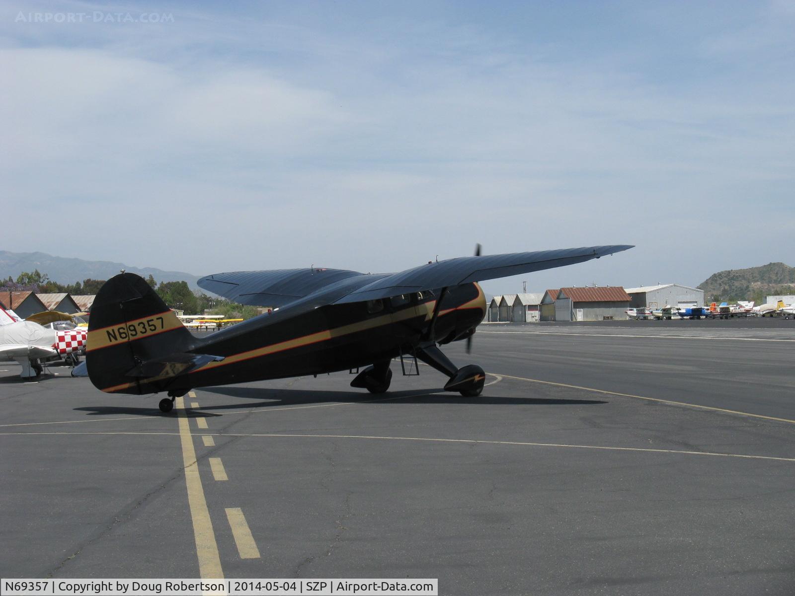 N69357, 1944 Stinson V77 Reliant C/N 77-448, 1944 Stinson V-77 by Vultee Aviation, Lycoming R-680-13 per engine data plate, 9 cylinder 300 Hp radial, note beautiful distinctive gull-wing shapes, taxi turn to 22 taxiway