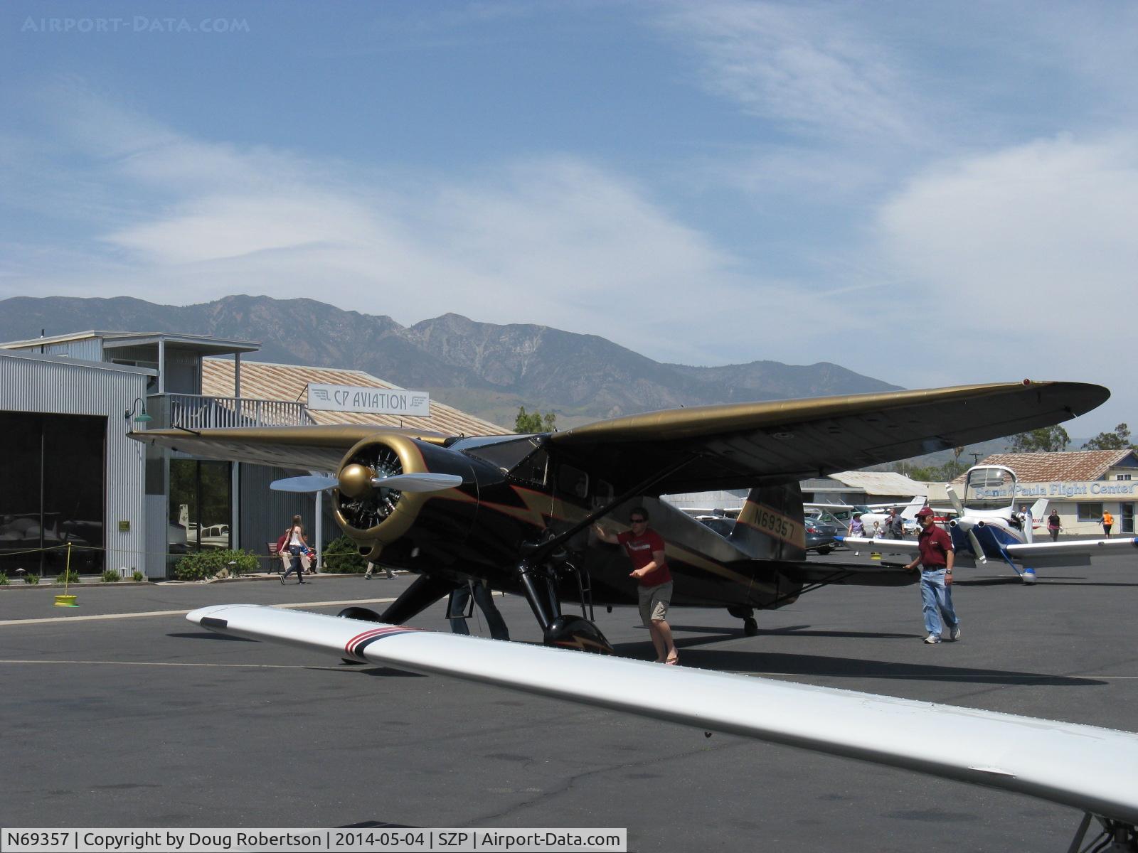 N69357, 1944 Stinson V77 Reliant C/N 77-448, 1944 Stinson V-77 by Vultee Aircraft, Lycoming R-680-13 per engine data plate, 9 cylinder 300 Hp radial in smooth cowl-no bumps, spotting to busy fuel dock