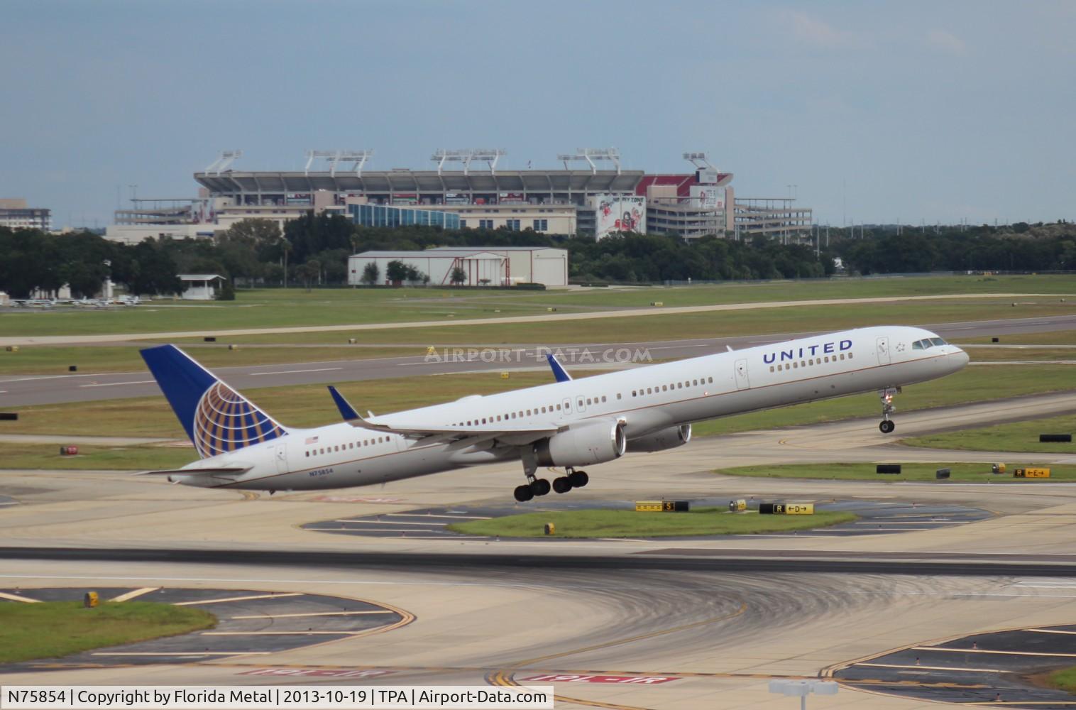 N75854, 2002 Boeing 757-324 C/N 32813, United 757-300 being used by the Tampa Bay Buccaneers NFL football team departing in front of their stadium