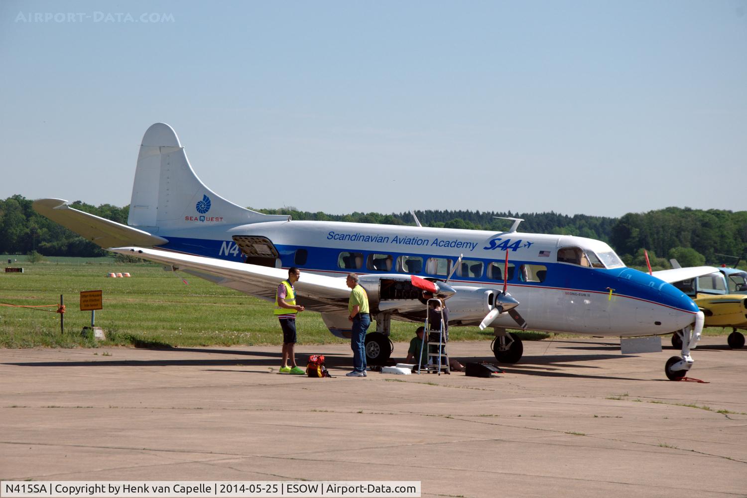 N415SA, 1954 De Havilland DH-114 Heron 2X C/N 14064, Riley Turbo Skyliner undergoing maaintenance on the platform of Västerås Hässlö airport. New are the Swedish Aviation Academy titles on the fuselage.