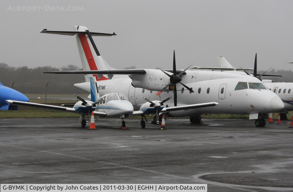 G-BYMK, 1996 Dornier 328-100 C/N 3062, With small friend at JETS