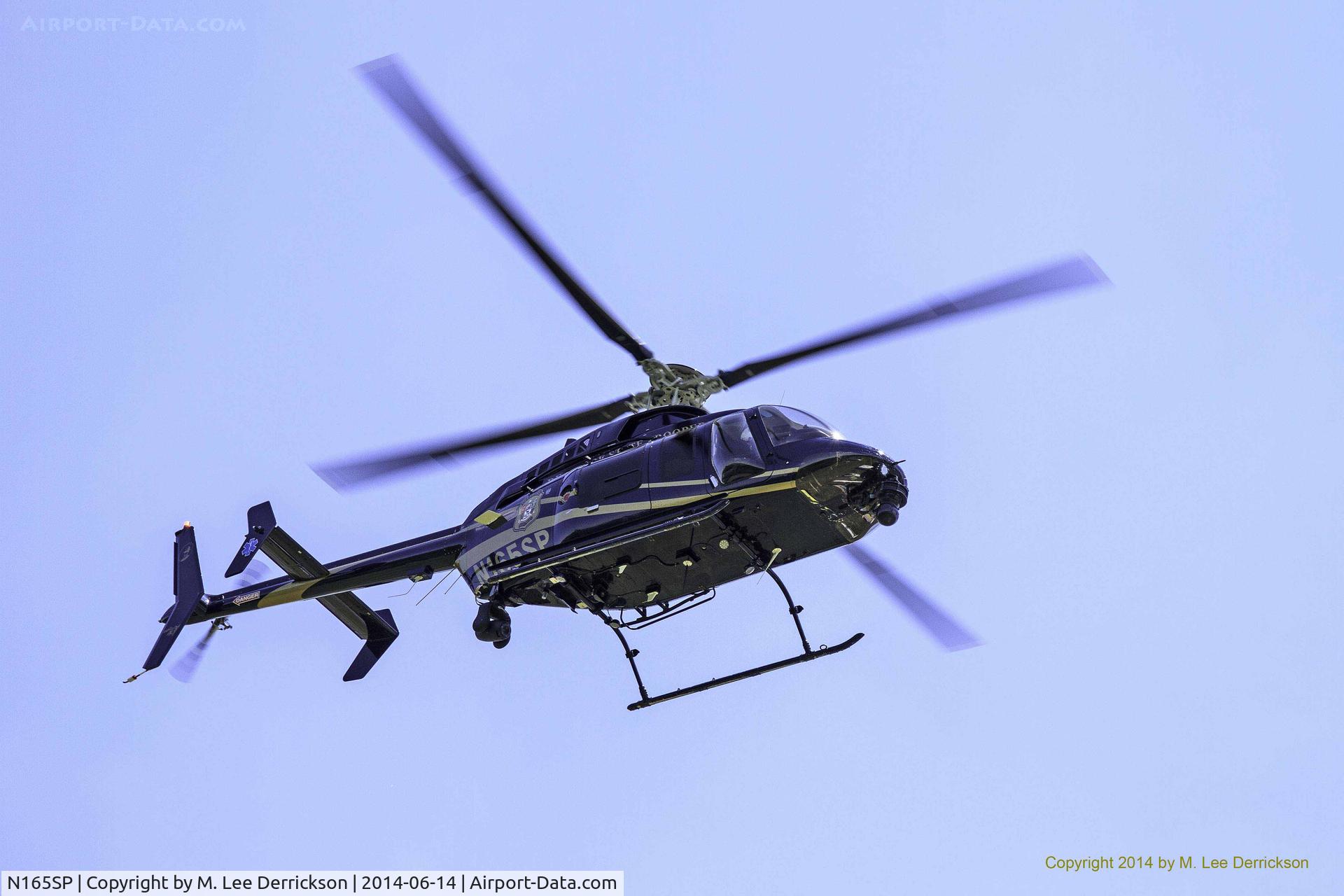 N165SP, 2000 Bell 407 C/N 53458, State Police helicopter flies over Brecknock Park, Camden, Delaware, after participating in Safe Summer Day activities.