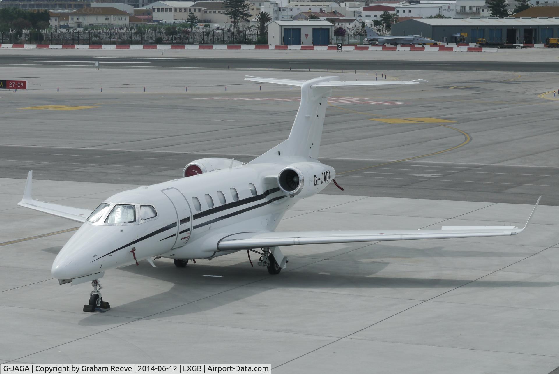G-JAGA, 2013 Embraer EMB-505 Phenom 300 C/N 50500134, Parked at Gibraltar.