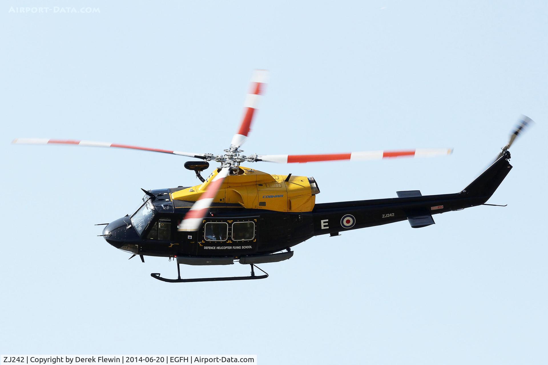 ZJ242, 1994 Bell 412EP Griffin HT1 C/N 36095, Griffin HT1, call sign VLL90, coded E, Search and Rescue Training Unit (SARTU), based at RAF Valley, seen banking away from runway 22 at EGFH.