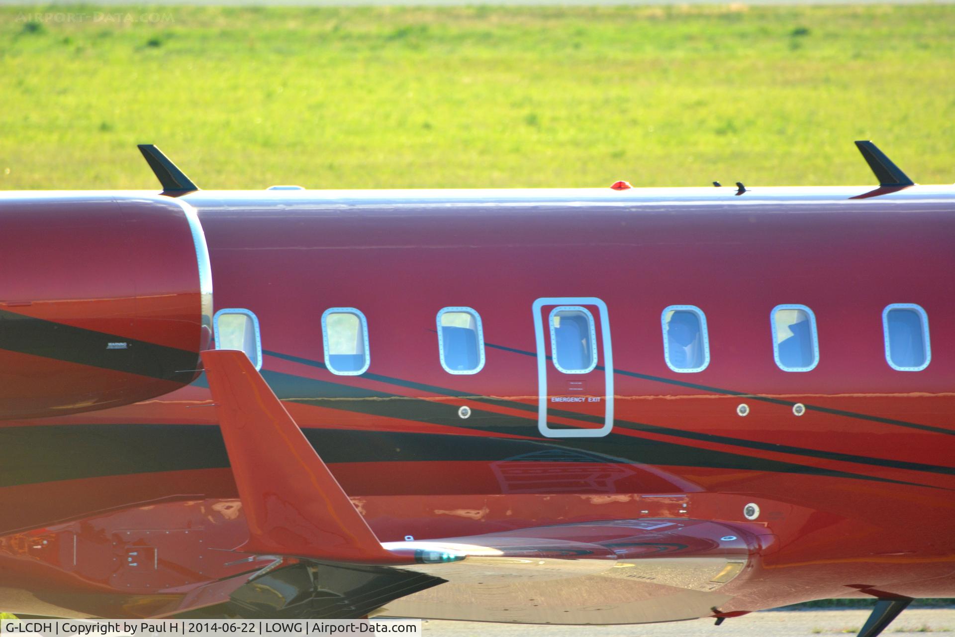 G-LCDH, 2012 Bombardier Challenger 605 (CL-600-2B16) C/N 5904, CL-600 of Lewis Hamilton at LOWG
Sitting at the third window from the right side