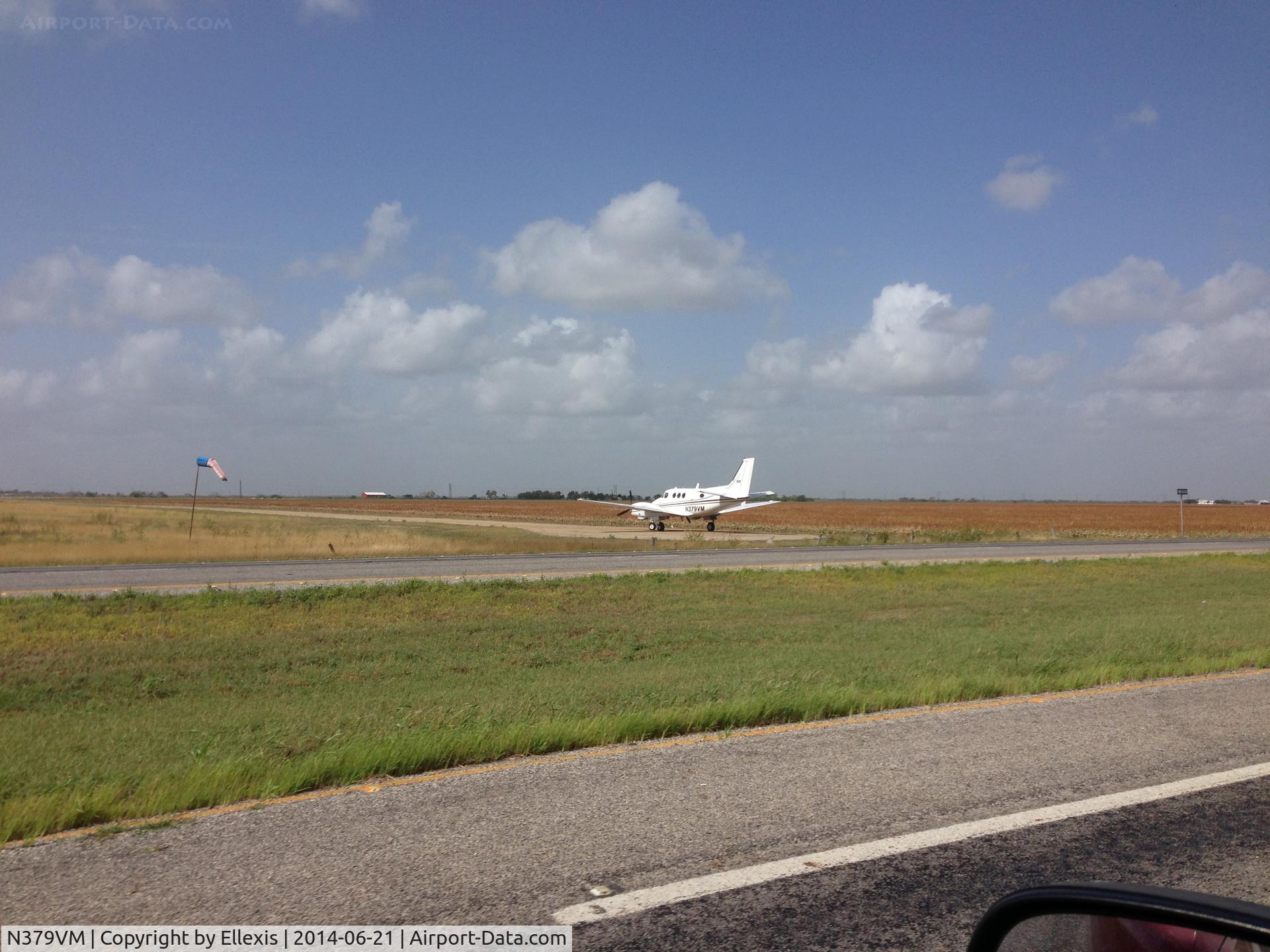 N379VM, 1972 Beech E-90 King Air C/N LW-27, While driving to Laredo on TX-44 near Robstown, TX, N379VM lined up on a dirt runway for takeoff.