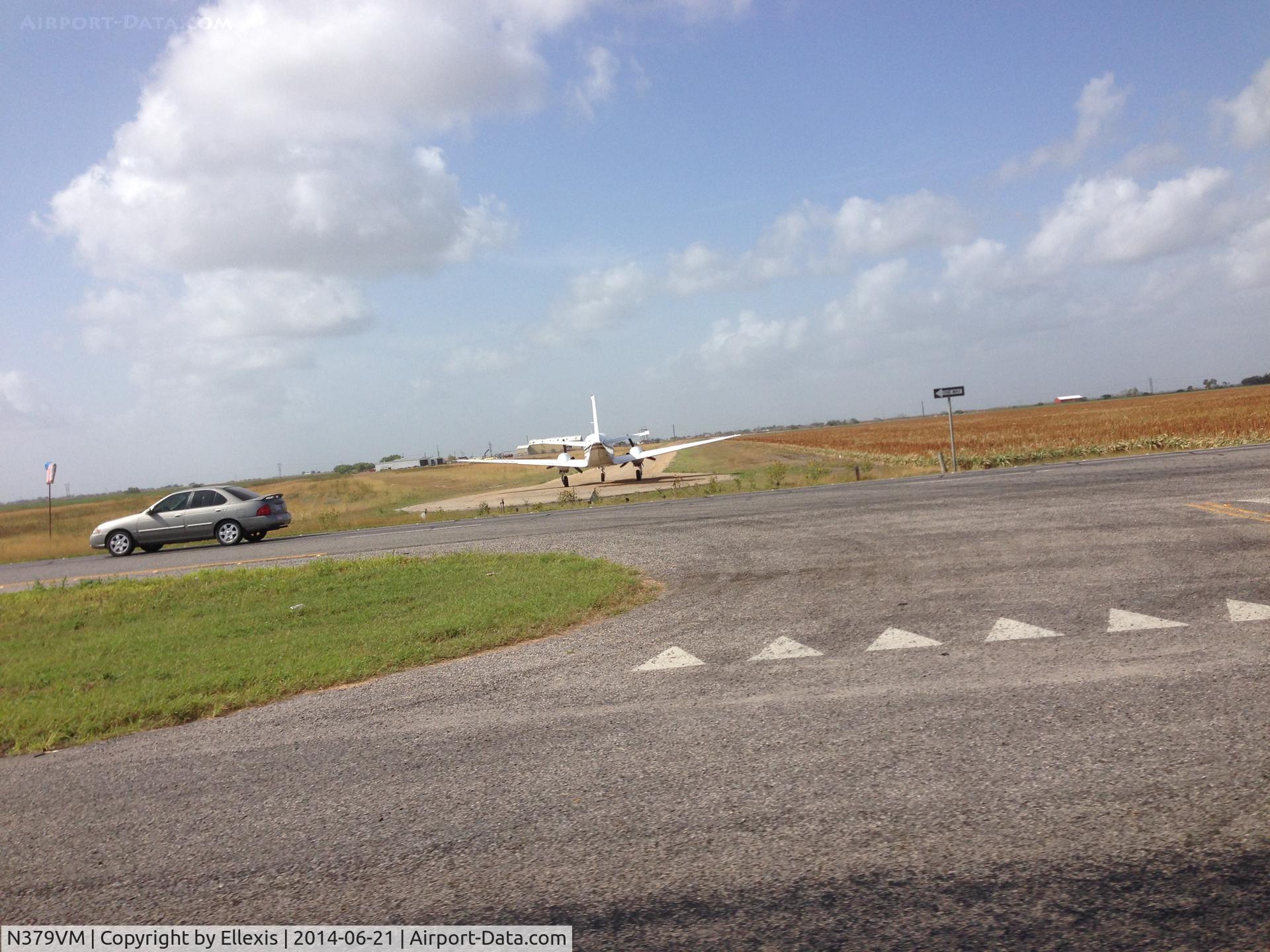 N379VM, 1972 Beech E-90 King Air C/N LW-27, While driving to Laredo on TX-44 near Robstown, TX, N379VM lined up on a dirt runway for takeoff.