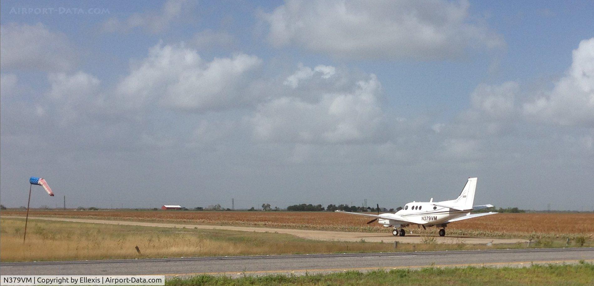 N379VM, 1972 Beech E-90 King Air C/N LW-27, While driving to Laredo on TX-44 near Robstown, TX, N379VM lined up on a dirt runway for takeoff. Cropped original photo at 100% resolution.
