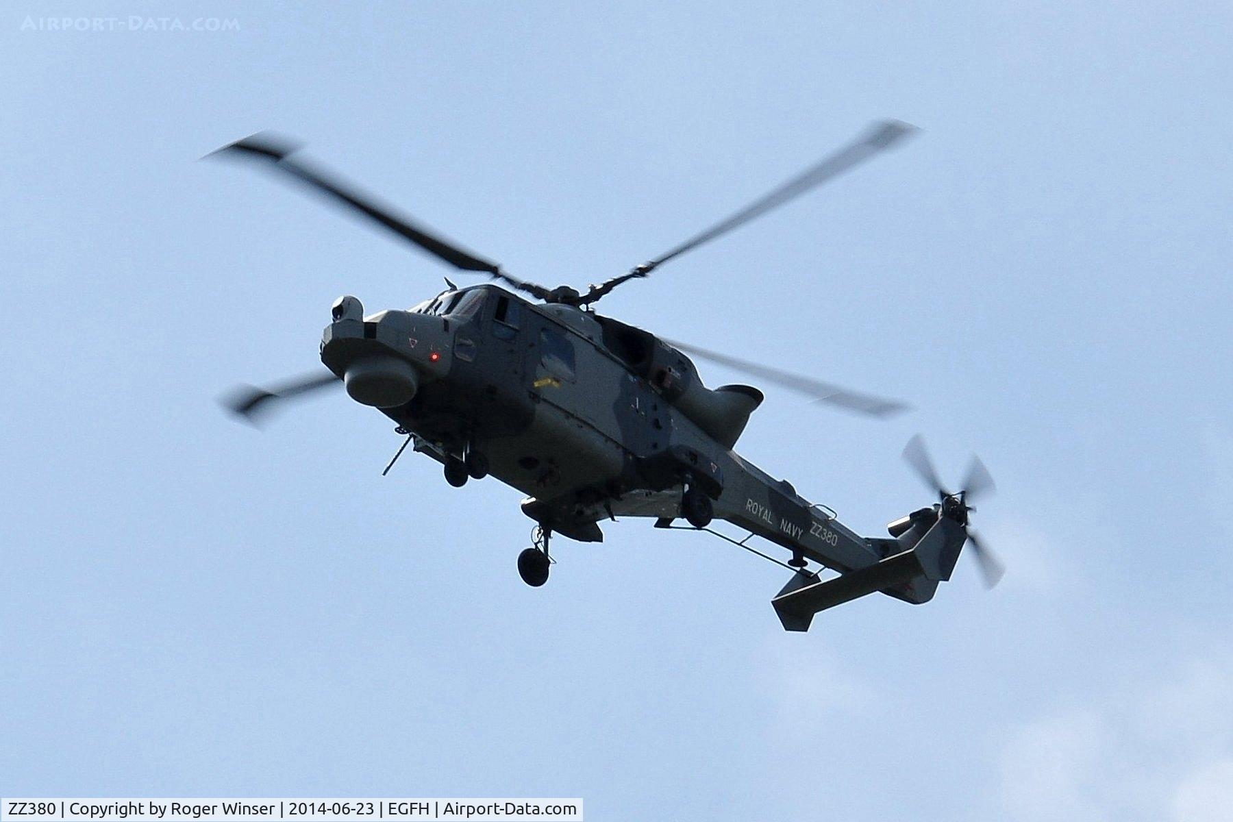 ZZ380, 2013 AgustaWestland AW-159 Wildcat HMA.2 C/N 499, Royal Navy Wildcat helicopter overhead the airport leading Talon formation (two Wildcats). Operated by 700W NAS based at HMS Heron (RNAS Yeovilton).