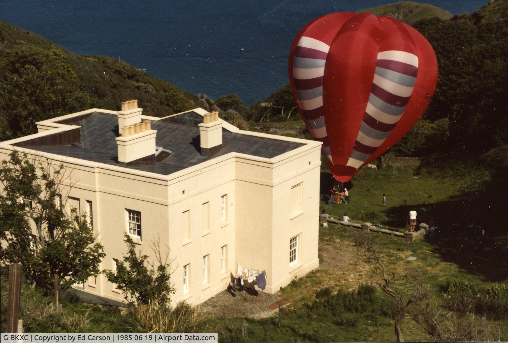 G-BKXC, 1983 Cameron Balloons V-77 C/N 973, Balloon prepared for take-off from Lundy, in front of the Marisco Tavern and carrying the first balloon post from the island.