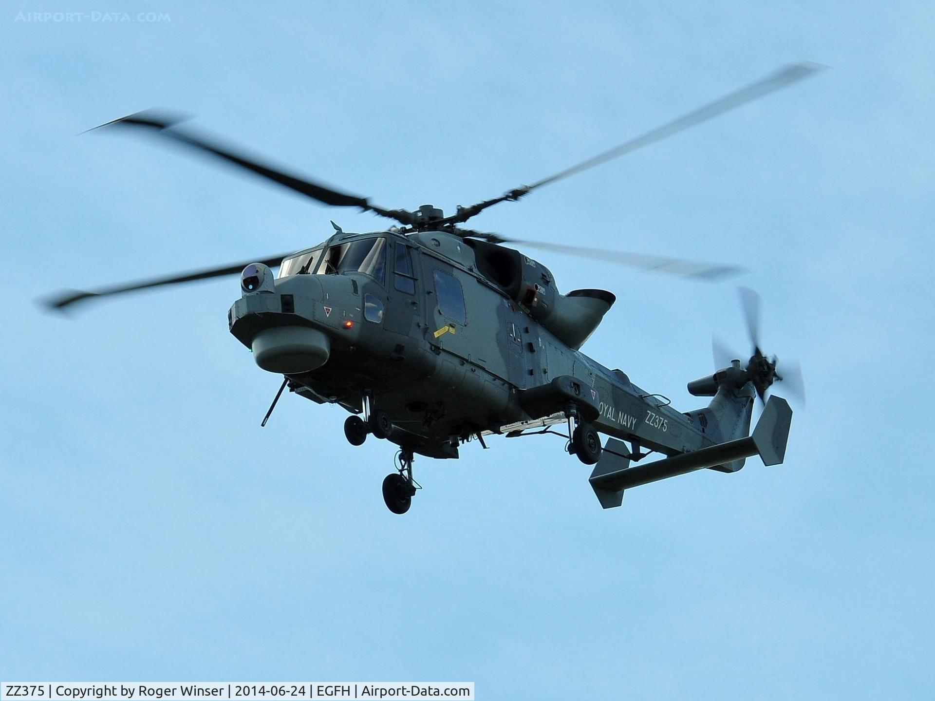 ZZ375, 2013 AgustaWestland AW-159 Wildcat HMA.2 C/N 494, Royal Navy Wildcat helicopter operated by 700W NAS flying over Swansea Airport whilst leading Talon Formation with ZZ380. Returning to thier base at HMS Heron (RNAS Yeovilton).