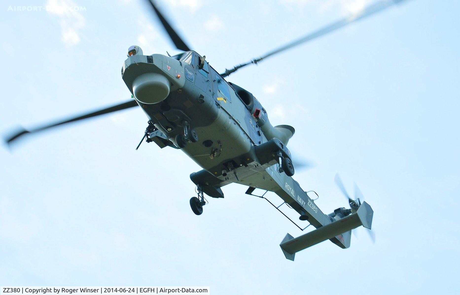 ZZ380, 2013 AgustaWestland AW-159 Wildcat HMA.2 C/N 499, Royal Navy Wildcat helicopter operated by 700W NAS flying over Swansea Airport as part of Talon Formation led by ZZ375. Heading for thier base at HMS Heron (RNAS Yeovilton).