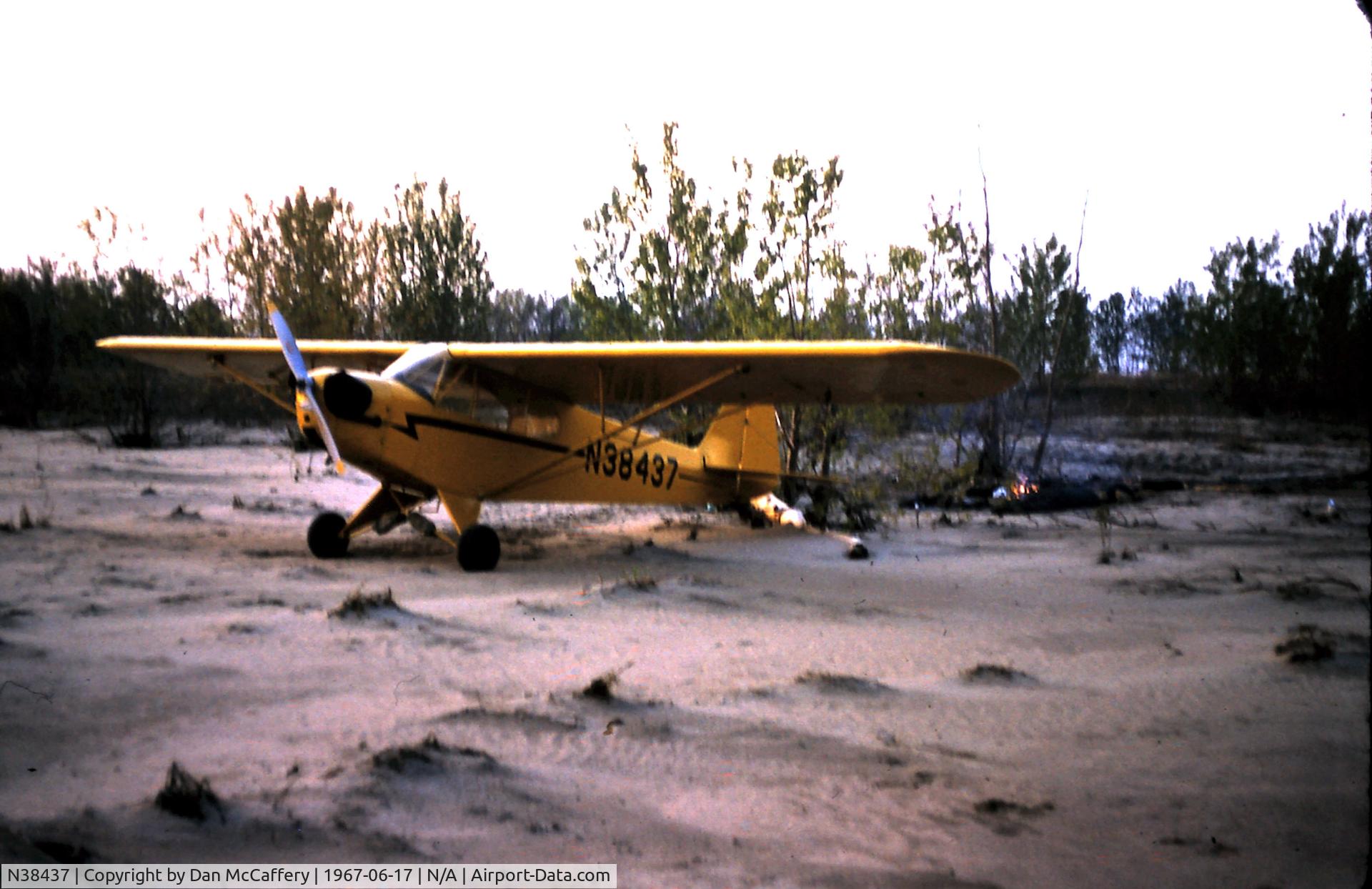N38437, 1941 Piper J3C-65 Cub C/N 7006, N38437 camping on Bird Island in Mississippi River by Memphis in 1967