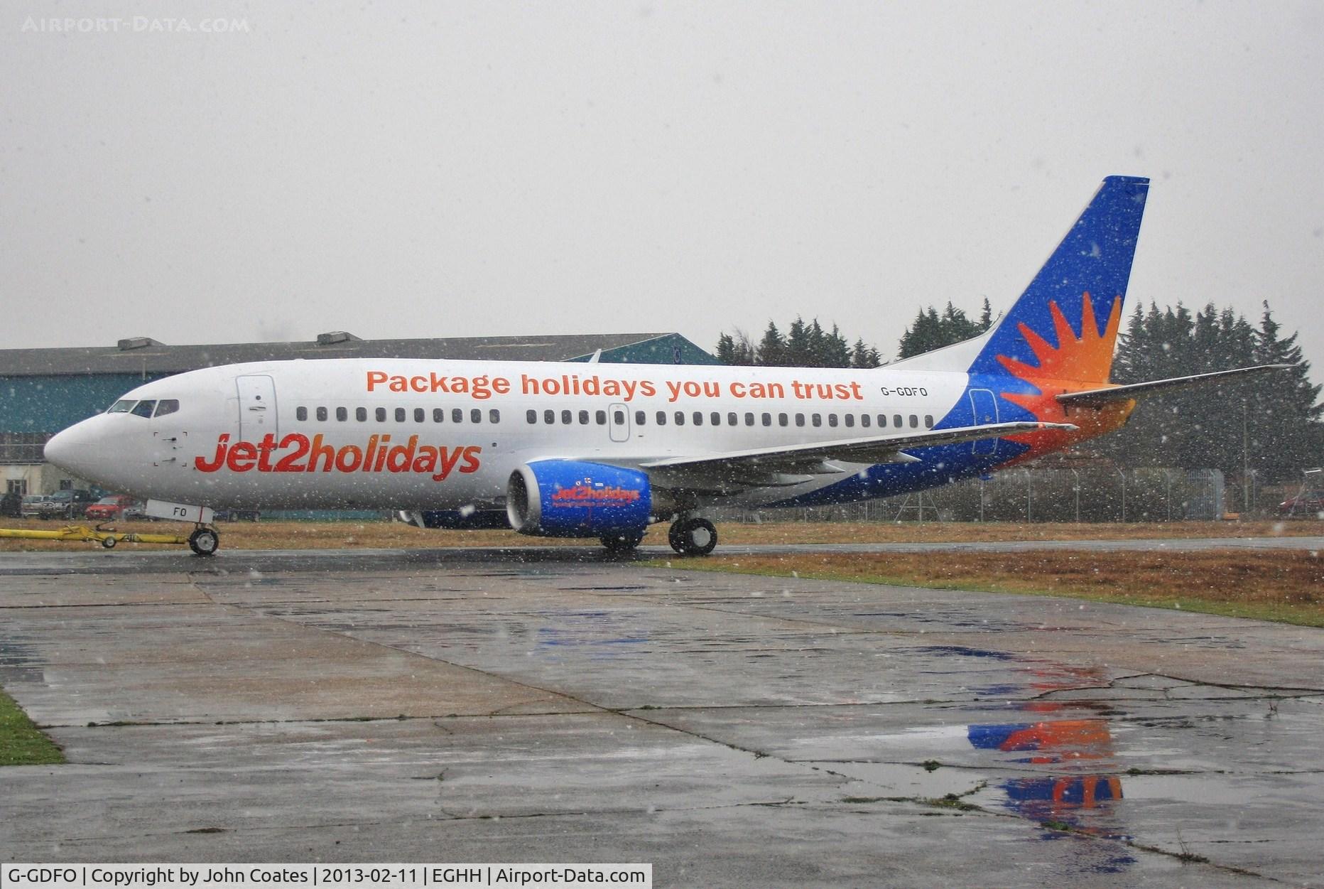 G-GDFO, 1998 Boeing 737-3U3 C/N 28740, Snowy departure after repaint