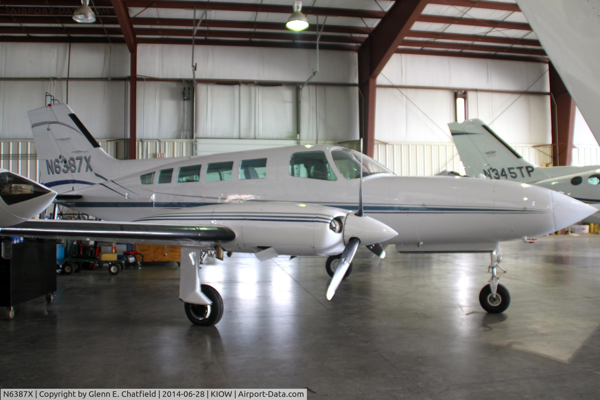 N6387X, 1978 Cessna 402B C/N 402B1350, Among aircraft displayed in a hangar during the air show