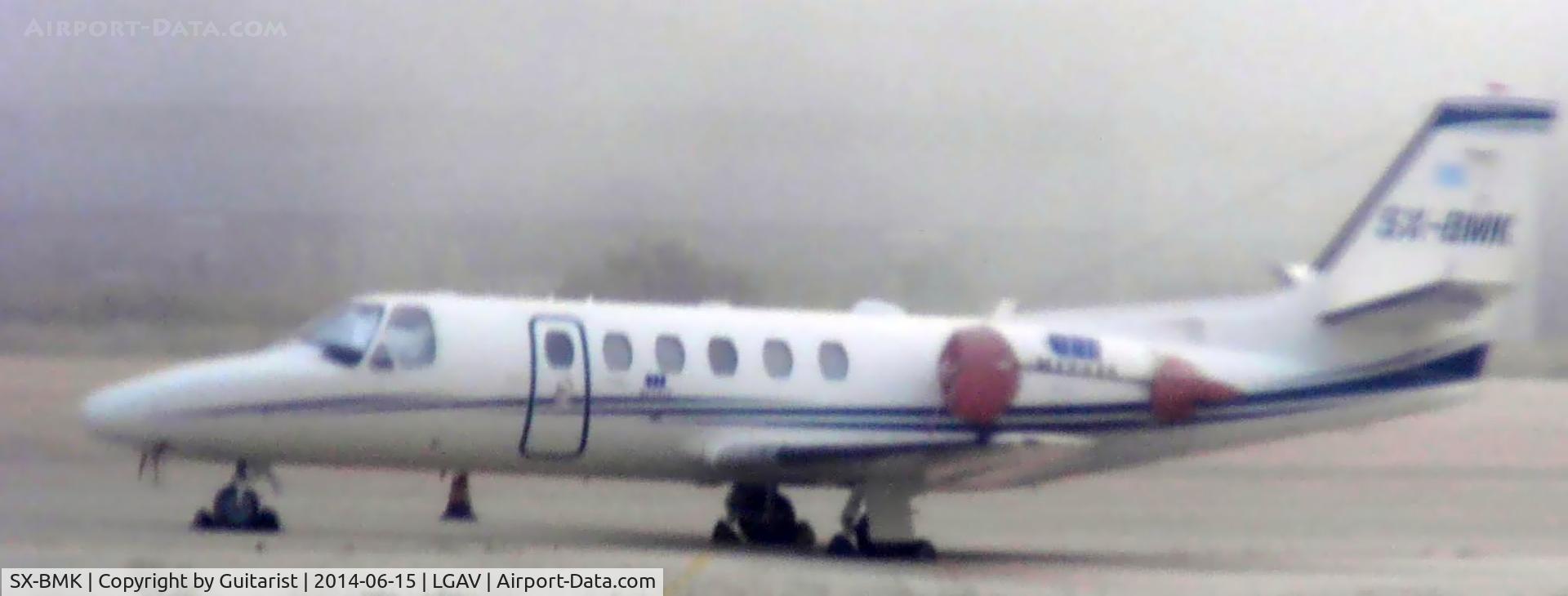 SX-BMK, 2000 Cessna 550 Citation Bravo C/N 550-0907, Taken on a moving DHC-8 while taxiing through the smoke of a nearby bush fire