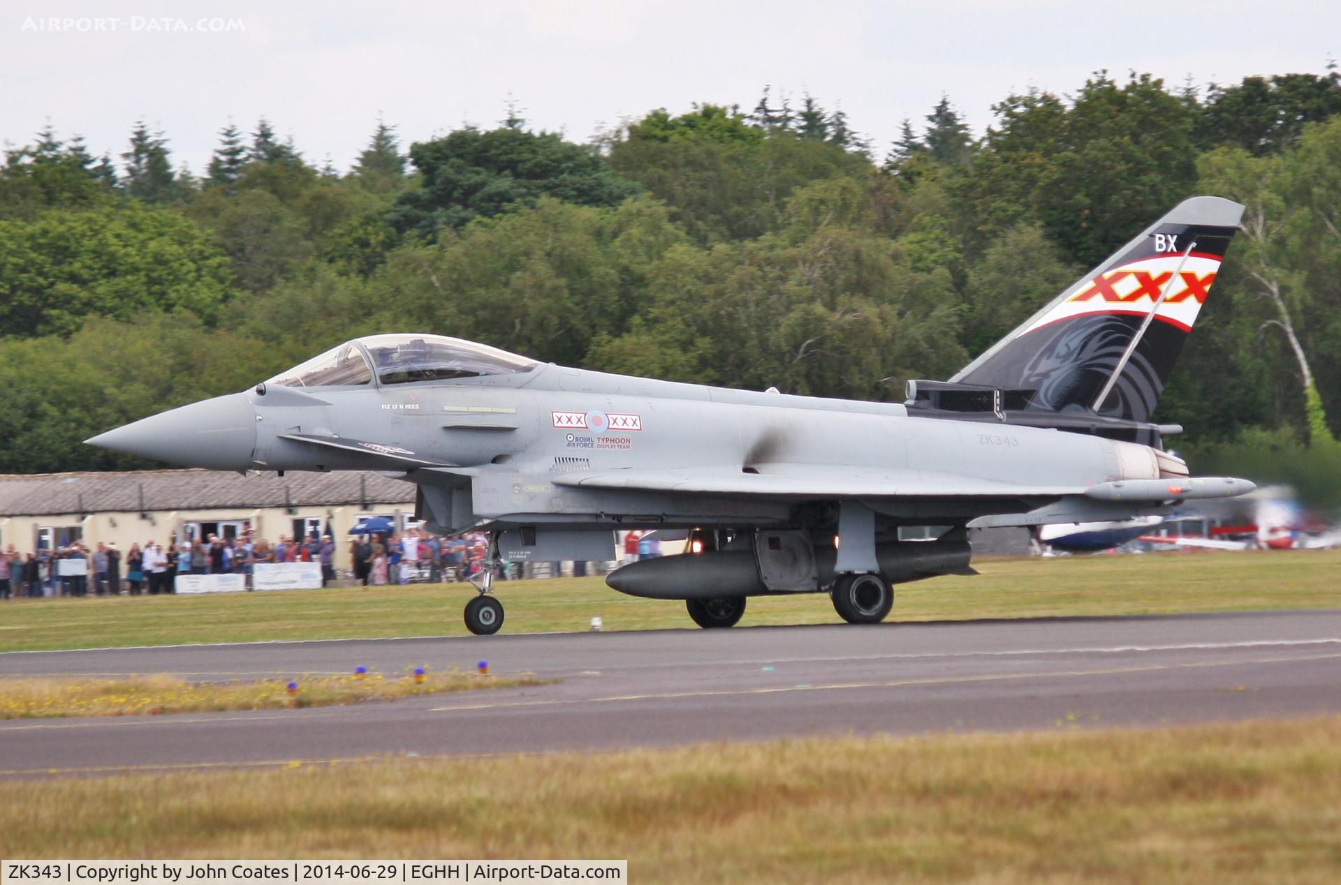 ZK343, 2012 Eurofighter EF-2000 Typhoon FGR4 C/N BS104/380, Off to display at Goodwood passed a packed cafe