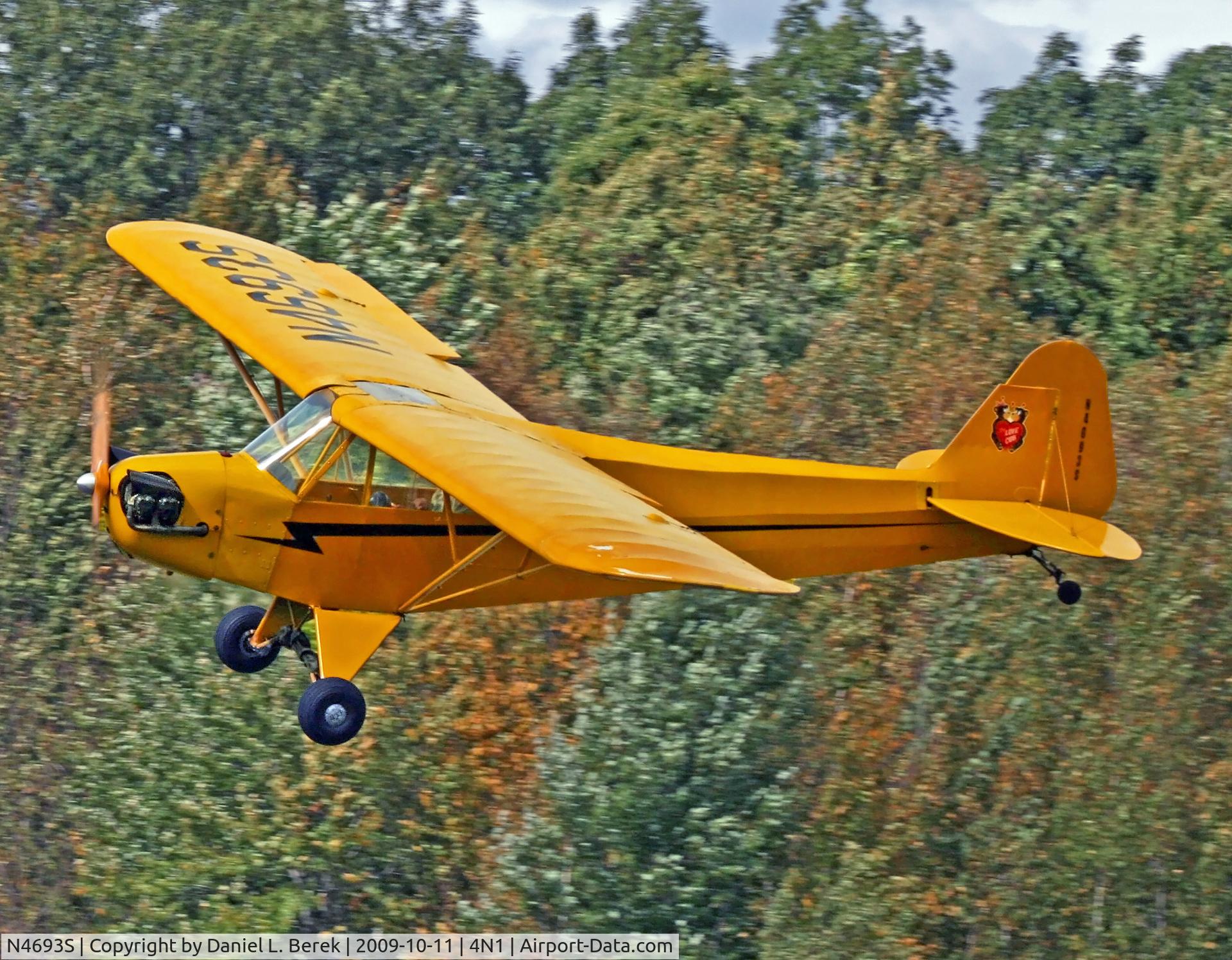 N4693S, 1946 Piper J3C-65 Cub C/N 18373, Lovely little 1944-vintage cub streaks past the woods at Greenwood Lake.