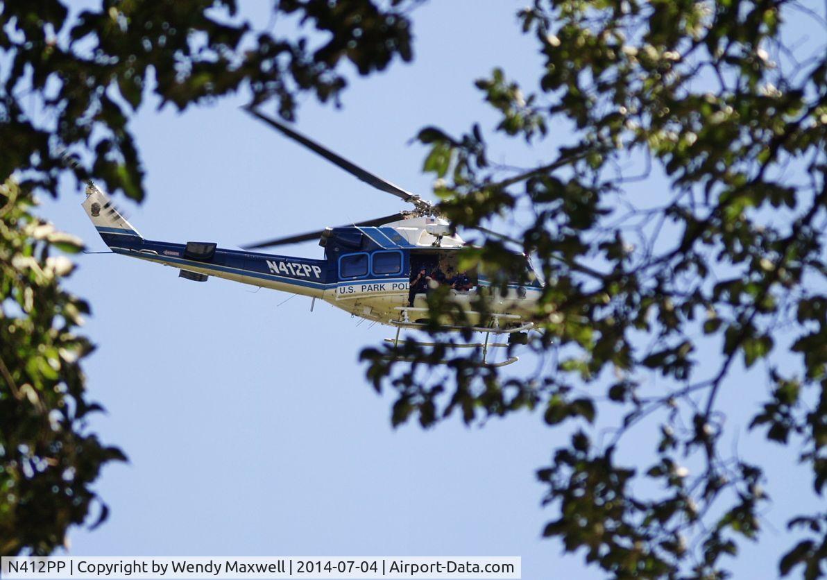 N412PP, 1990 Bell 412 C/N 33207, This was taken in Washington, DC on July 4, 2014. Those are police gunners on the helicopter which was circling around and hovering over the Lincoln Memorial and reflecting pool. This is a US Park Police helicopter assigned to the DC area.
