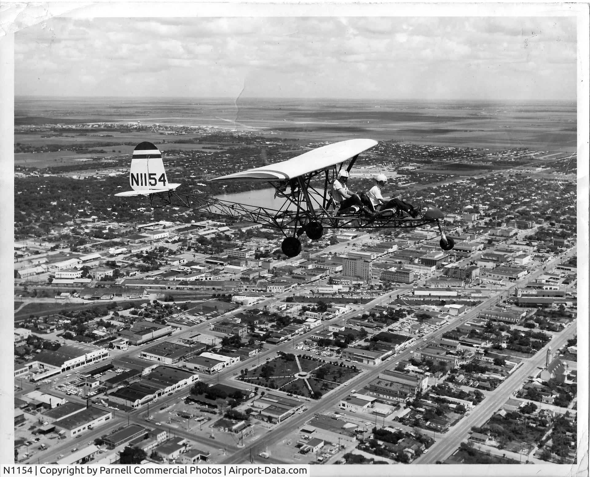 N1154, 1968 Breezy RLU-1 C/N 1, When I was about 12 (1969), I rode in this Breezy with the original builder/owner (front seat in photo), a family friend, at Confederate Air Force Base, Harlingen, Texas (background). Photo was a souvenir after my thrilling ride. Can't remember names.