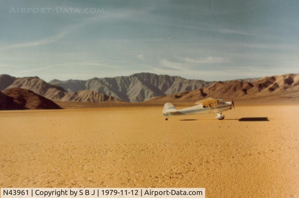 N43961, 1946 Taylorcraft BC12-D C/N 7620, On dry lake outside of Death Valley,Ca. Dry lakes are very  nice to land on but be careful for water under the surface or your entire day ( 172s on 5-29-64 & 7-4-75 & C150 on 10-3-71) could be ruined ! Almost happened to me on one- almost- dry lake .