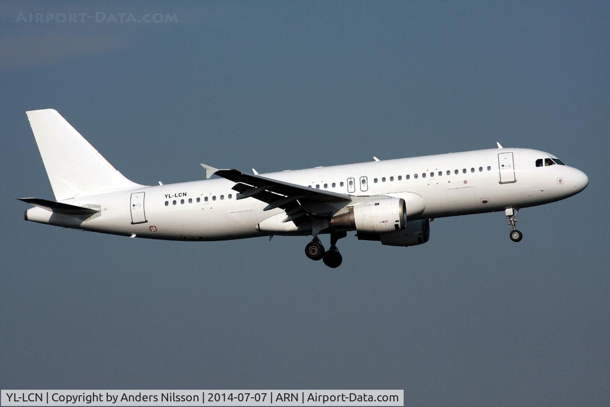 YL-LCN, 1997 Airbus A320-211 C/N 662, On short final for 19L.