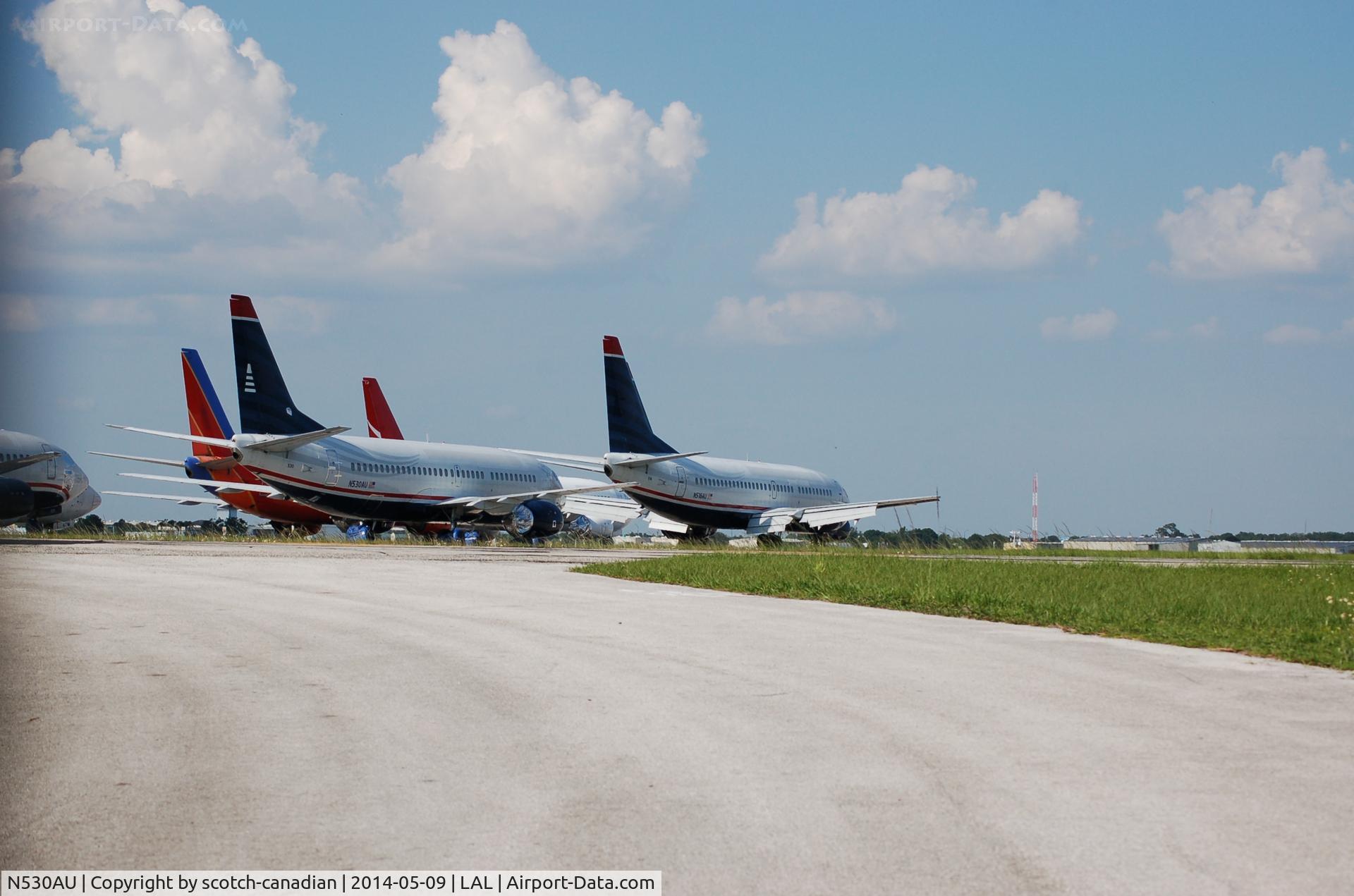 N530AU, 1989 Boeing 737-3B7 C/N 24412, 1989 Boeing 737-3B7, N530AU and 1987 Boeing 737-3B7, N516AU at Lakeland Linder Regional Airport, Lakeland, FL