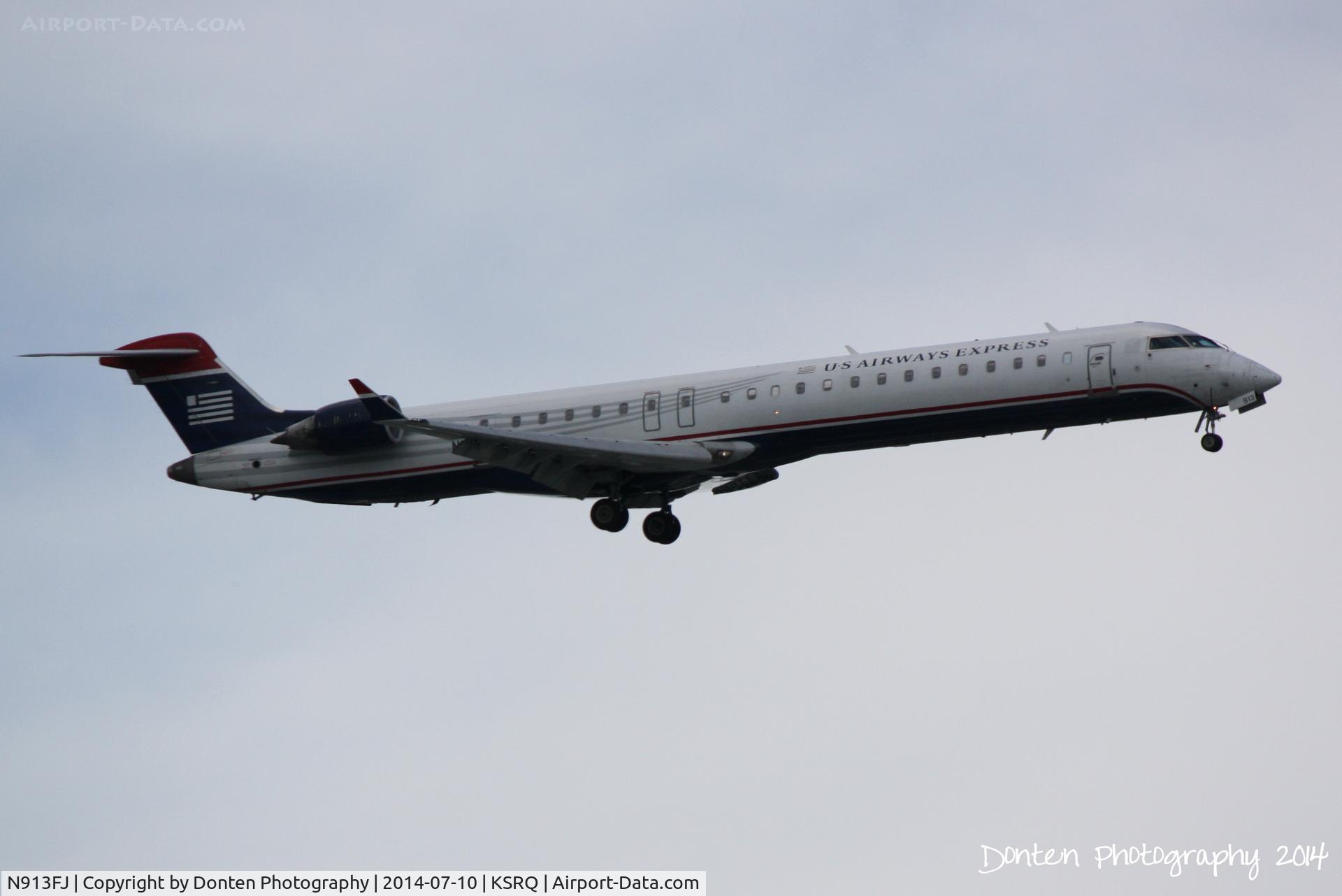 N913FJ, 2004 Bombardier CRJ-900ER (CL-600-2D24) C/N 15013, US Air Flight 2886 operated by Mesa (N913FJ) arrives at Sarasota-Bradenton International Airport following a flight from Charlotte-Dougalas International Airport