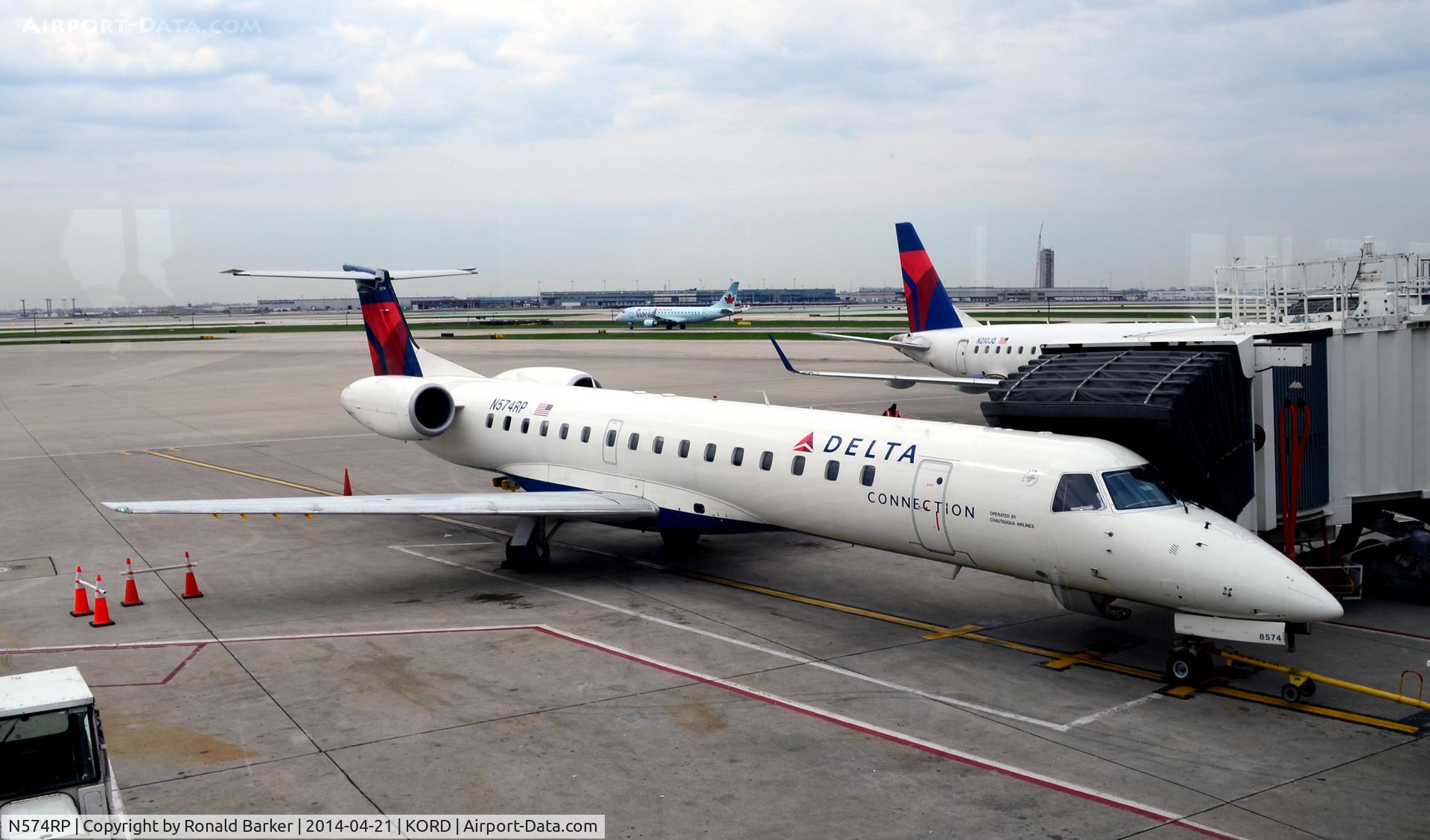 N574RP, 2004 Embraer ERJ-145LR (EMB-145LR) C/N 14500845, At the gate O'Hare