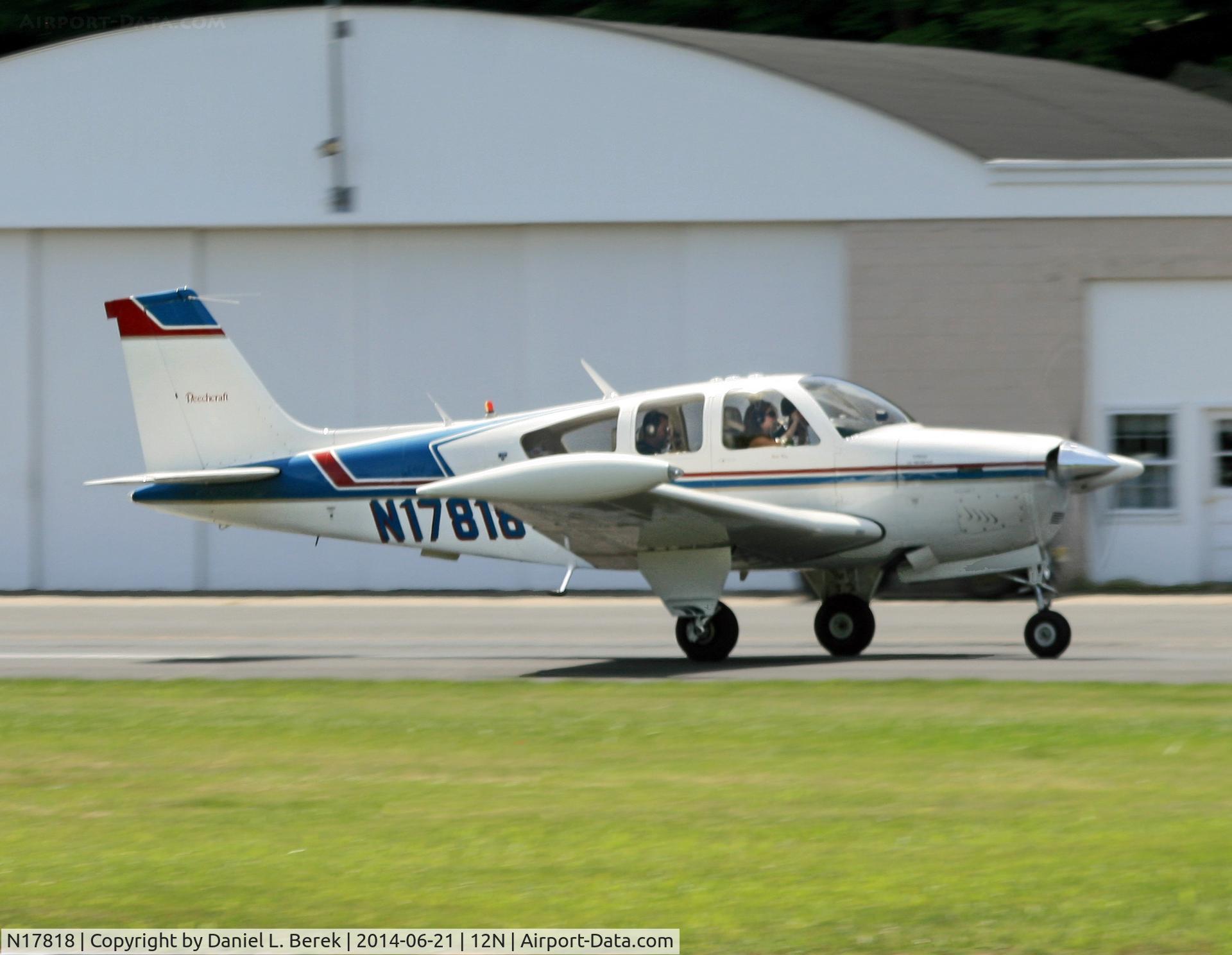 N17818, 1977 Beech F33A Bonanza C/N CE-710, A nice 1977 single-tail Beech Bonanza swoops in at Aeroflex Andover.