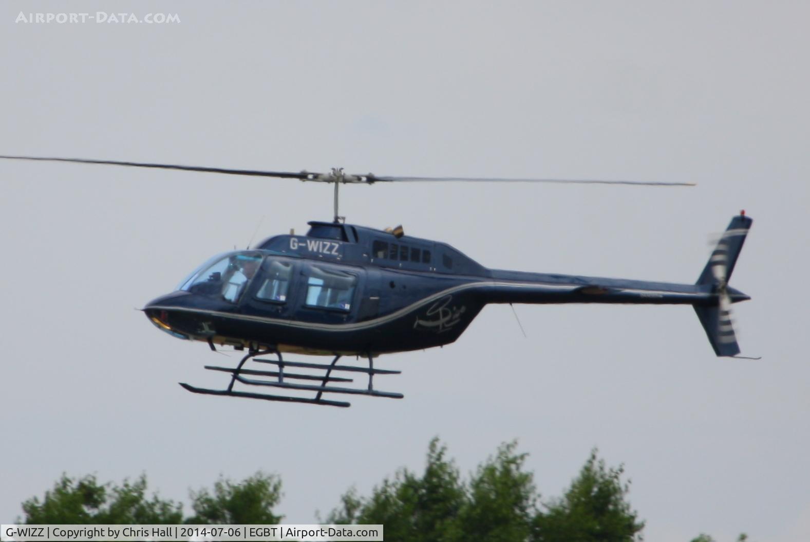 G-WIZZ, 1977 Agusta AB-206B JetRanger II C/N 8540, being used for ferrying race fans to the British F1 Grand Prix at Silverstone