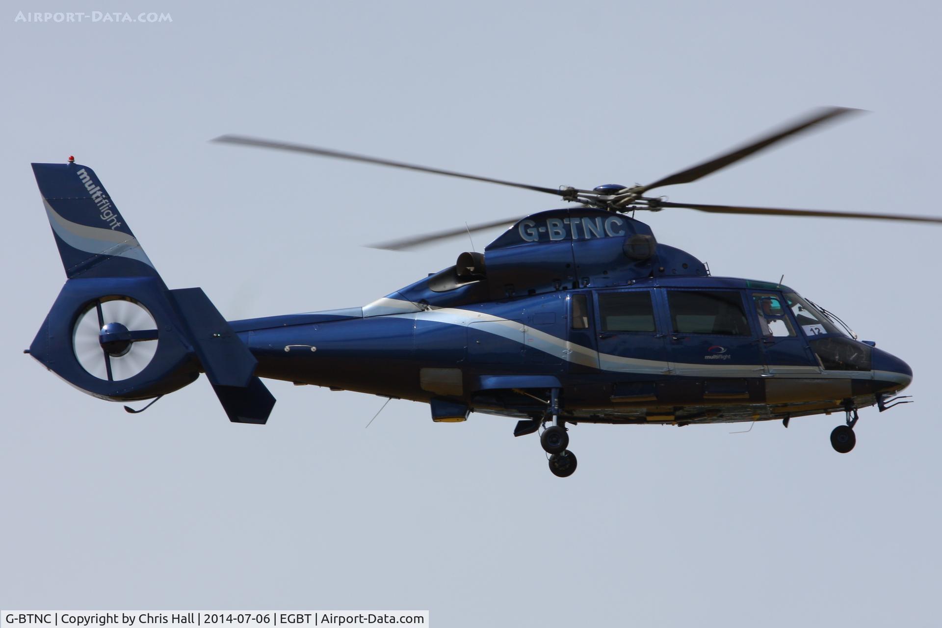 G-BTNC, 1991 Aerospatiale AS-365N-2 Dauphin C/N 6409, being used for ferrying race fans to the British F1 Grand Prix at Silverstone