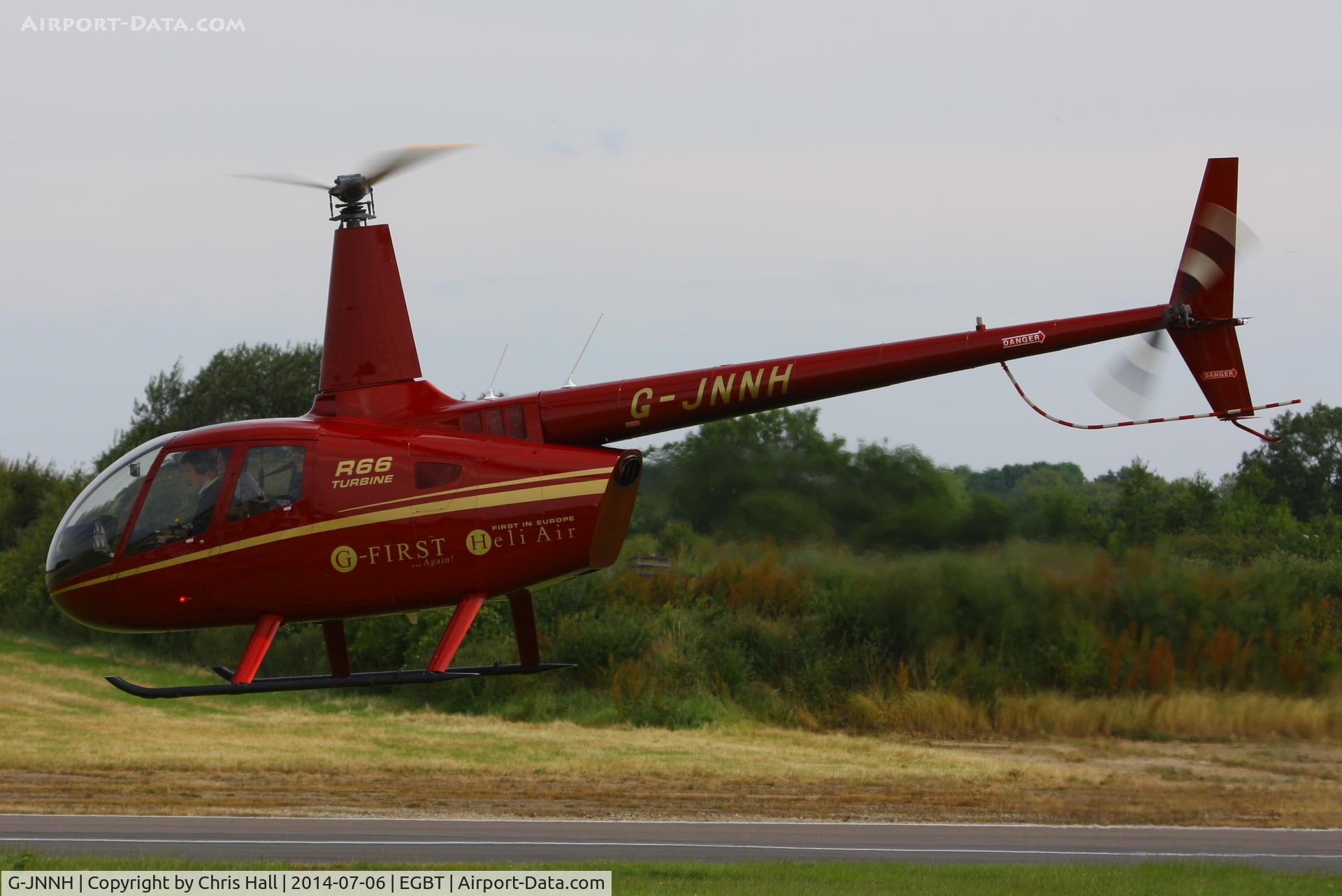 G-JNNH, 2011 Robinson R66 Turbine C/N 0016, being used for ferrying race fans to the British F1 Grand Prix at Silverstone
